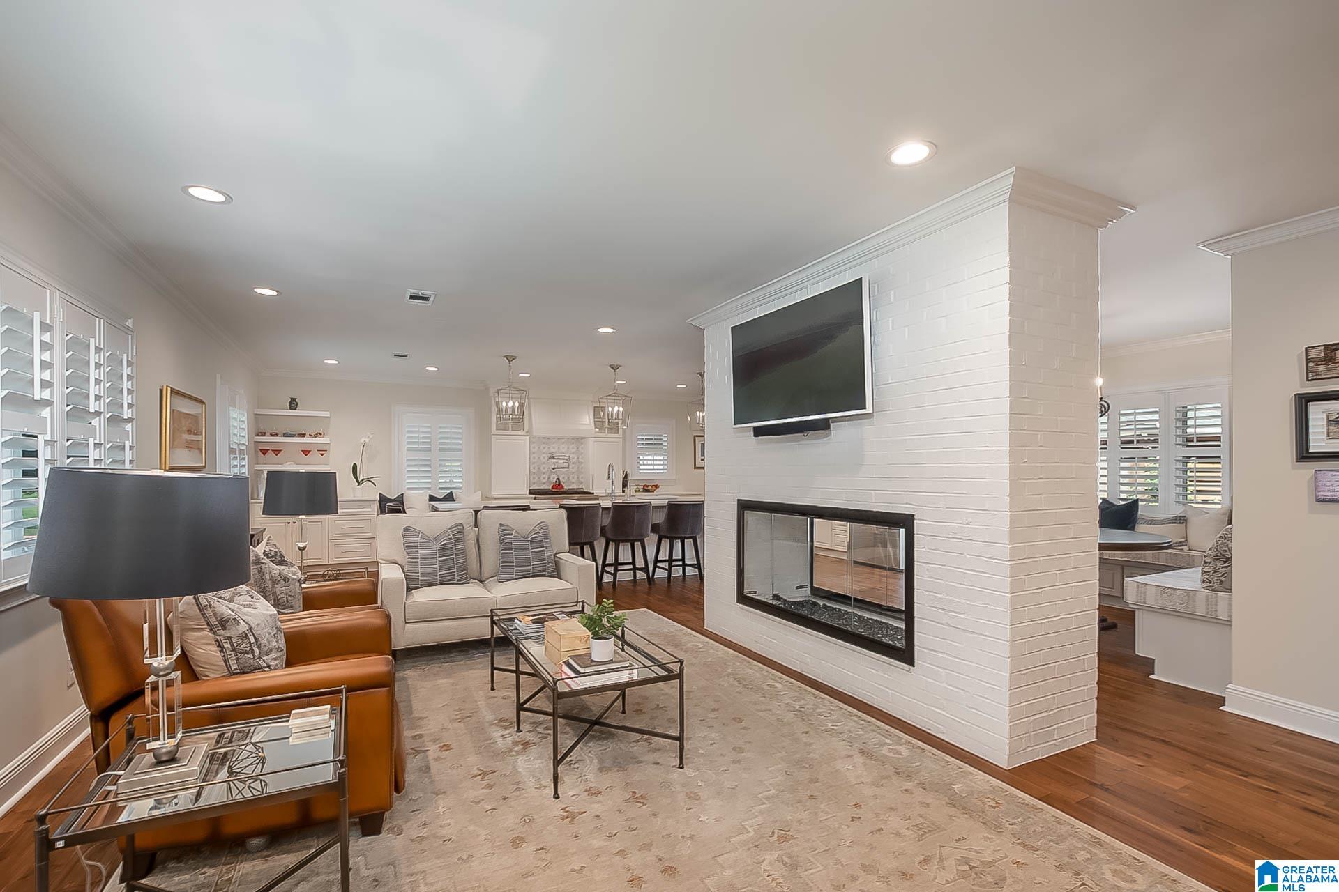 Walk downtown, the river, or Bryant-Denny in minutes! Every inch of this house has been updated, upgraded, & made fabulous! The gourmet kitchen has double wall ovens, a large island, custom cabinetry, a gas range with pot filler, & quartz countertops. This functional floor plan includes custom banquette seating areas & a fireplace as the centerpiece of the room. A graciously sized primary suite is on the main level & features a stunning primary bath & walk-in closet. The lower level has a large den, 2 beds, 2 baths, a full kitchen, & laundry. Enjoy the outdoors by sitting around the built-in fire pit located on your custom stone & brick patio. This estate has meticulously maintained grounds & an impeccable floor plan.This type of home in this location is rarely available & won't last long!