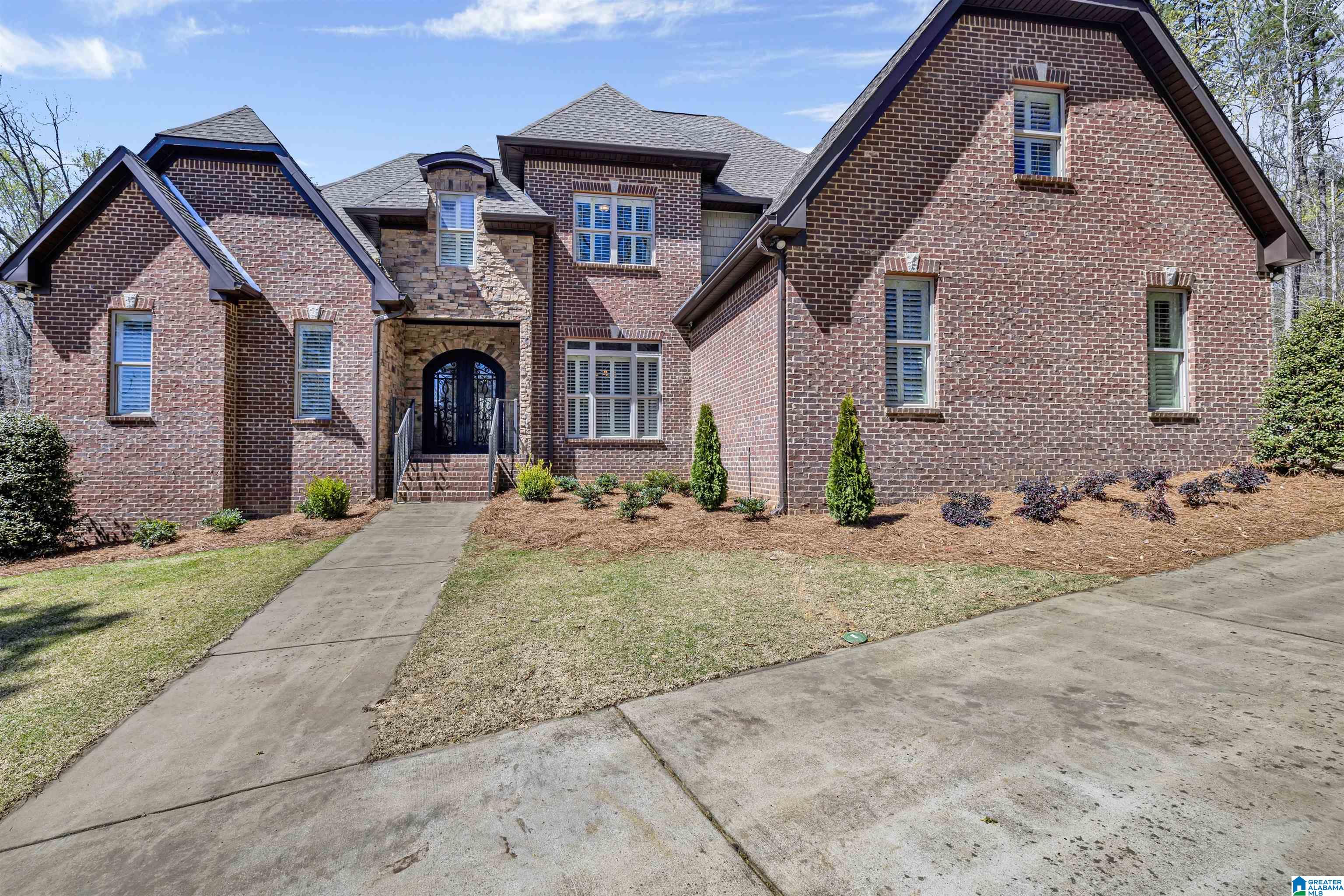 Custom full brick built home in Carrington with tons of parking. This is a must see from the stone wood-burning fireplace, custom kitchen, huge bedrooms/closets to your own sanctuary with the salt water pool in the back yard.  The downstairs has 1900 sq. ft. finished with a full bathroom and storage.  Get your showings in for this one because it will amaze the buyers!!