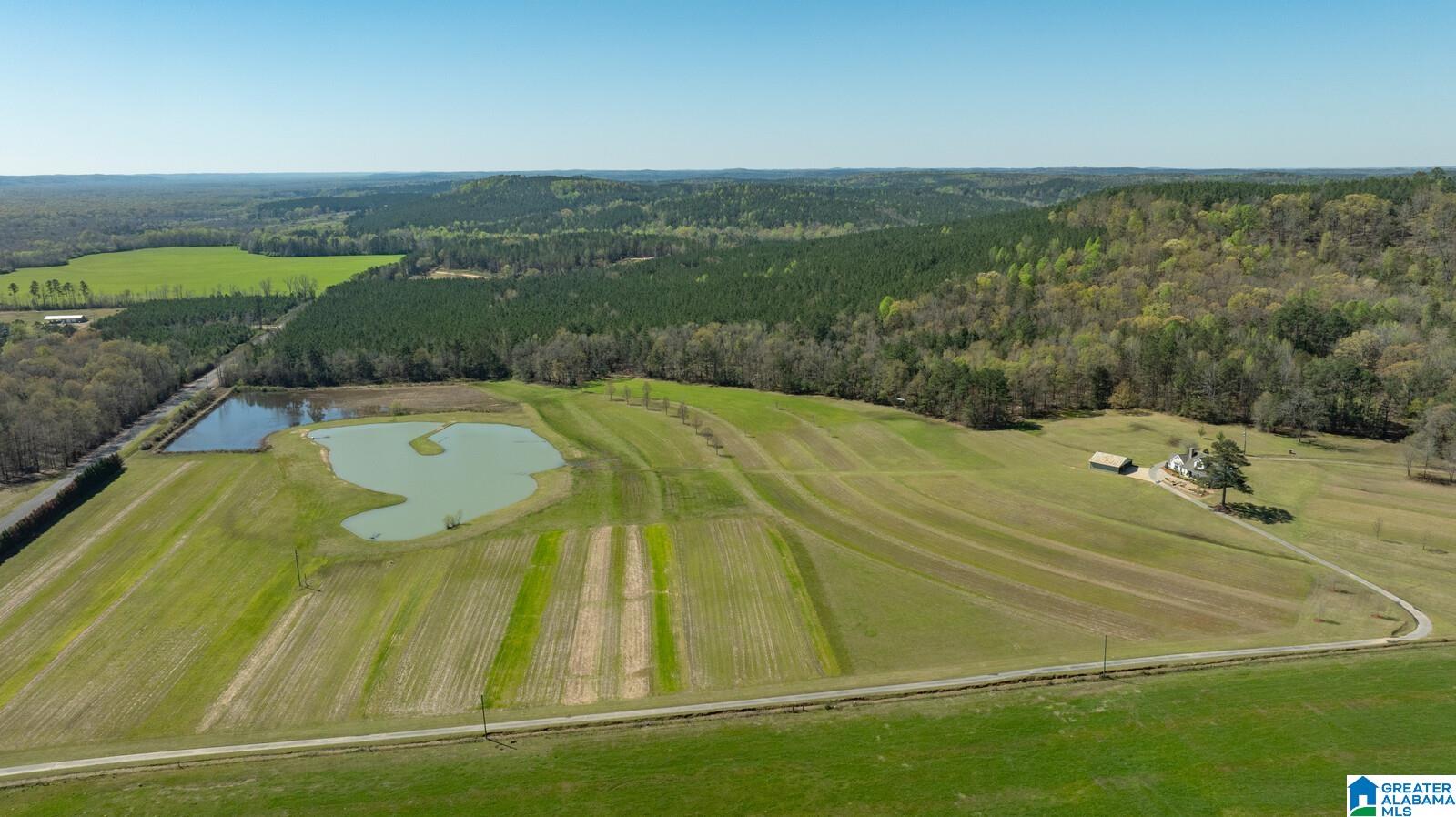 Acreage includes the additional Parcel 17-02-04-0-000-003.000 The owners have spared no expense customizing this gated 178+- acre estate in North Tuscaloosa County,30 minutes to the heart of Tuscaloosa. A 2.85 acre lake stocked with bass and bream, 2 acre duck impoundment stocked with crawfish, wildlife food plots, 5 green fields & hunting blinds & 2 miles of well maintained trails to access hunting areas. Your home offers an open floor plan 4 bedroom 3.5 bath built in 2012 with addition added in 2020 offering 2 primary suites on main level and 2 spacious bedrooms upstairs. Spend your evenings relaxing on the custom flagstone patio or screen porch surrounded by detailed landscape.178 +- acres(35 acres open flat land,19 acres of hardwoods,118 acres of pine plantation roughly 20 years old)