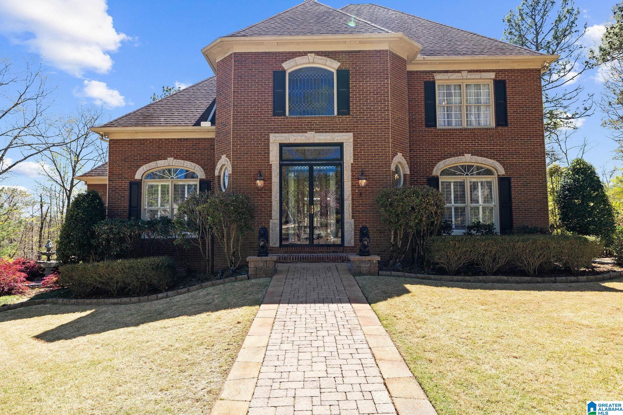 RARE OFFFERING: This one-owner custom-built home is nestled on almost an acre lot in a cul-de-sac in gated Highland Lakes. Situated on a park-like setting w/running brook on both sides of the driveway leading to the house all add to the curb appeal of this much-loved home.Step into the house and you see its charm throughout w/barreled 20 ft plus ceiling, exquisite crown moulding & custom details. Make family memories in this memorable dining room. Great room w/fireplace & built-ins, curl up w/a great book in the cozy keeping room w/fireplace & custom ceilings, built-ins & 2 sets of french doors. Huge kitchen w/ample-sized breakfast room, airy sunroom w/exposed brick arches. Spacious master bedroom, sumptuous master bath & adjoining laundry room. Upstairs offers 2 generous-sized bedrooms & en suite baths. Finished basement is perfect for in-law suite, office/study, bonus room (could be used as a bedroom) & space for expansion. Sizable screened back porch overlooking total privacy.