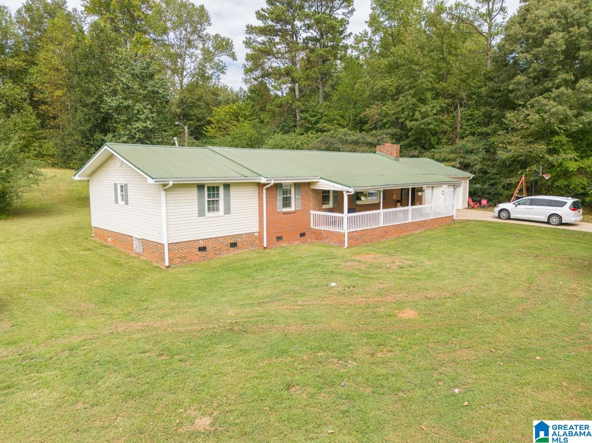 Seller is motivated and offering $7,500 closing cost. Bring us an offer!! This home literally has it all and is in Ranburne School District on 2 acres of land!!  When you walk up to the home, you are immediately impressed with the HUGE front porch. This is ideal for that morning cup of coffee! Inside you are going to love the fireplace and entry area. The open floor plan makes entertaining in this home amazing! Inside the kitchen you will appreciate the coffee bar, stainless appliances, and the separate panty, giving you tons of additional space. The home features original hardwood floors in the living room and hallway. You will adore the convenience of the 2 secondary bedrooms sharing a jack and jill bathroom and the primary bedroom being extra spacious. When you come in from the back deck you will enjoy the separate mud room and all of that extra room! This home truly has it all and makes you feel like you have your own private slice of Heaven!