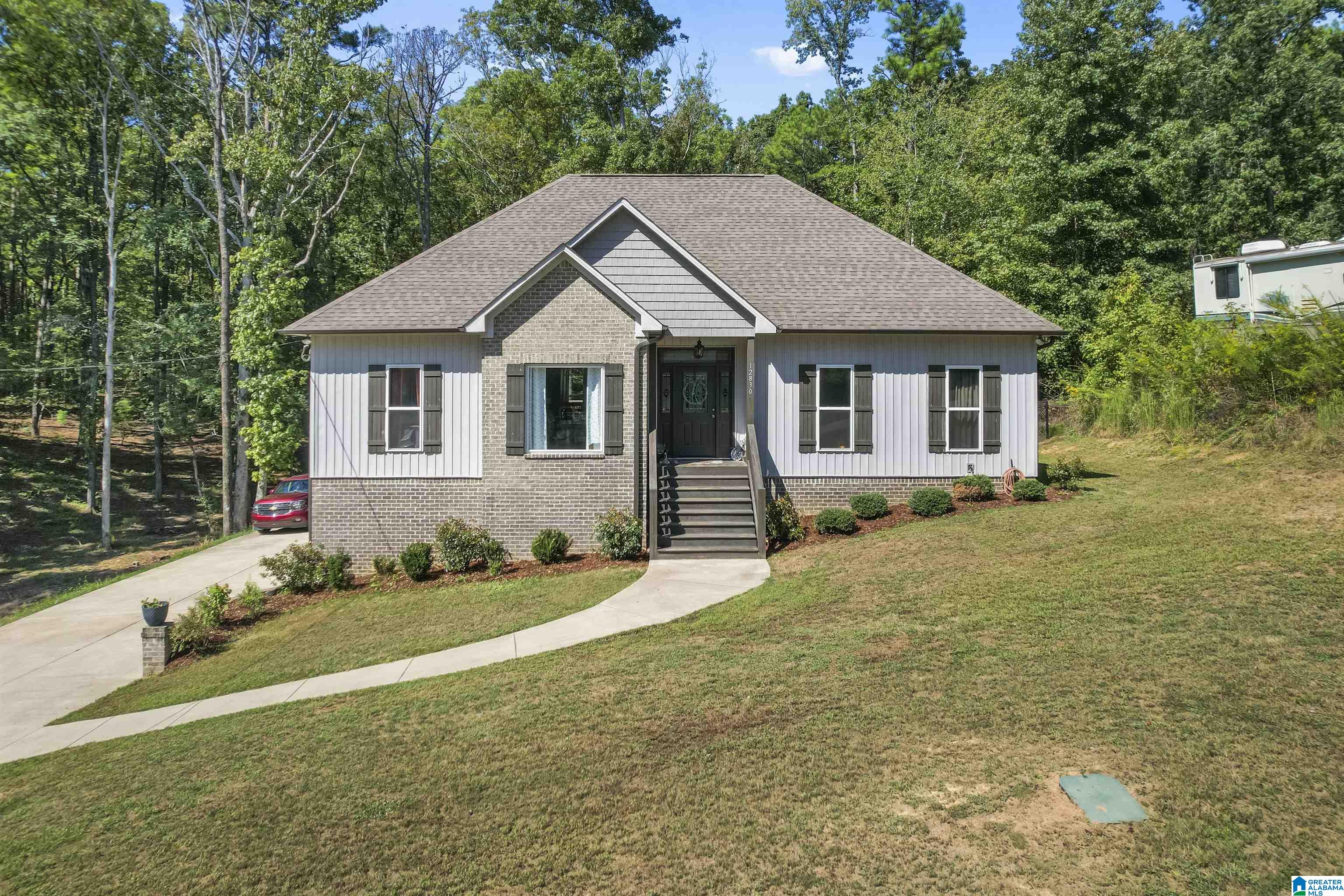 Nestled in a serene, wooded setting in Million Dollar Lake, this charming single-level home built in 2020 offers comfort and style. Boasting three spacious bedrooms and two full baths, the home features an open-concept kitchen with a large island that seamlessly connects to the family room, perfect for entertaining. A formal dining room adds elegance with details in the coffered ceiling and trim, while the cozy breakfast nook provides scenic views of the wooded backyard. The owner’s suite is a private retreat with a tranquil sitting area, a plush bath with double vanities, large tub/separate shower and an extra-large walk-in closet. The unfinished basement offers ample space for future expansion, and a two-car garage. NOTE:  This home sale has 2 lots (21 & 22 parcel id's) The second lot 21 is to the left of the driveway. *Inquire about the sellers assumable va loan with 2.75% interest rate.*