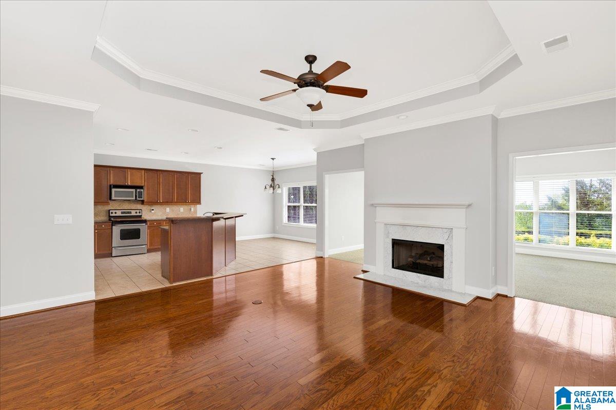 This amazing home is located on Summit Point in sought after Somersby!  Summit Point is only one street & located on the ridge with phenomenal views of the downtown skyline from this side of the street.  You'll love this floorplan which features a large sunroom off the family room that has walls of windows on every side to take in the view. Kitchen is large & open to breakfast room w/window wall toward views. Family room w/beautiful hardwoods, trey ceilings & fireplace.  Formal dining room is next to kitchen w/cove ceilings & hardwood floors.  Master suite is located on main level along with guest room. Staircase to unfinished attic space which boasts additional 634 square feet for future expansion or great storage.  2-car main level garage w/storm shelter.  NO STEPS-One level living at its finest! This one will go fast on this most desirable street where homes rarely become available because people don't want to move!  Interior newly painted!  Ready to move in!! Come see today!
