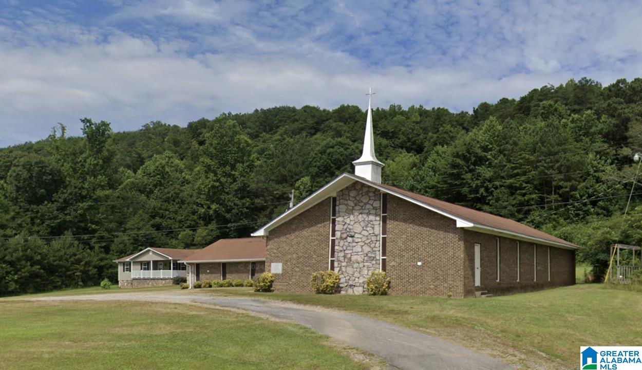 Discover this spacious 1-Level Brick Church on 3+ Acres in Cordova, AL This full brick, one-level church building offers over 5,300+ square feet of versatile space on 3+ acres, providing room to grow both inside and out. The property features a welcoming chapel with generous seating, a large open fellowship hall ideal for gatherings and events, multiple classrooms for educational or ministry use, and dedicated office space. Located just over 6 miles from I-22, this property combines convenience with a peaceful setting in the heart of Cordova, AL. A rare opportunity for a congregation or community-focused organization seeking space, functionality, and accessibility.