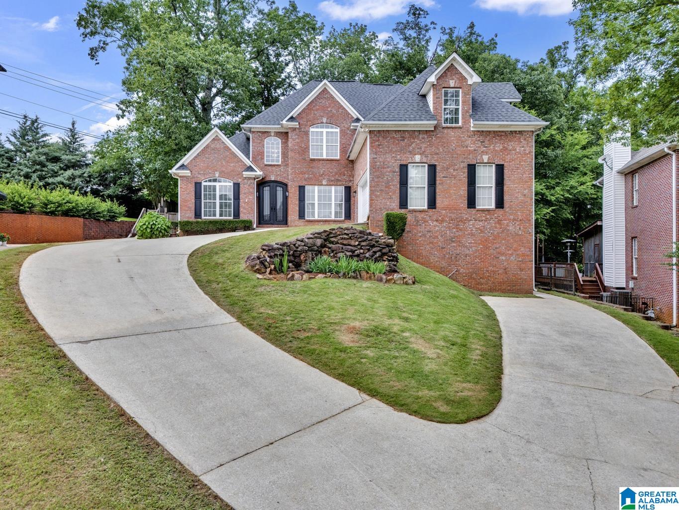Beautifully updated full-brick home in the heart of Hoover's Lake Crest, built in 1998 & ready for its next chapter. This spacious home offers a formal living & dining room, a soaring 2-story family room with fireplace & a main-level primary suite with luxury bath & walk-in closet. The main level also features a half bath, laundry room & convenient main-level garage. Upstairs, you'll find three large bedrooms, a full bath & a versatile bonus space. The basement level includes a private-entry in-law suite—ideal for extended family or guests with a 2nd full kitchen/breakfast nook, den, bedroom & full bath—plus additional unfinished space for storage or future expansion accessible from the main level. With fresh updates throughout, this home is a perfect blend of classic charm & modern potential. A blank canvas waiting for your personal touch! (NEW paint, refinished hardwoods, referb kitchen cabinets, hardware, lighting, plumbing fixtures, carpeting & new tile & glass shower in Primary BA