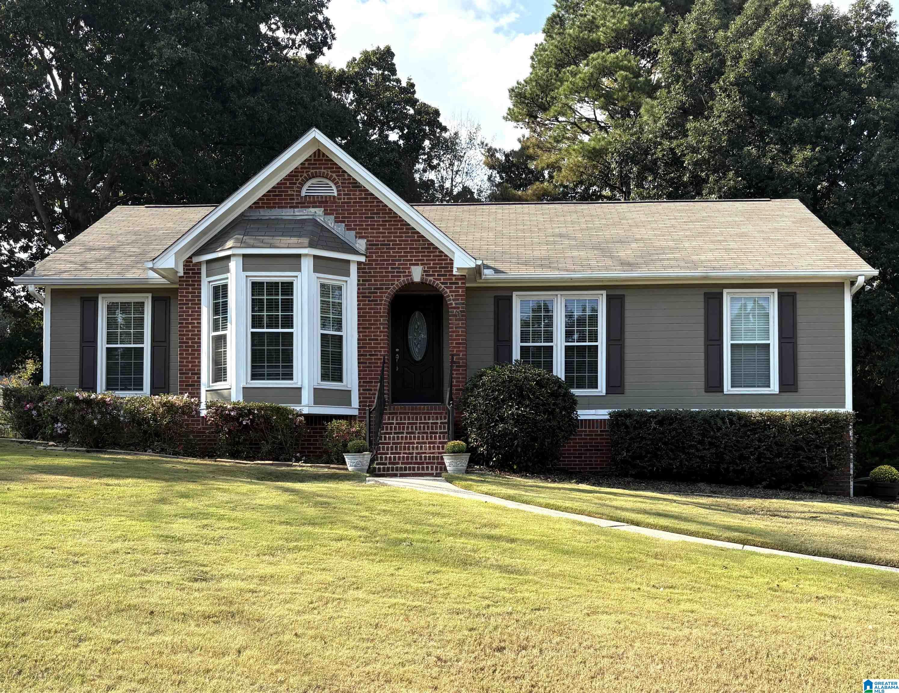 Welcome to 6804 Candlewood Lane in the Candlewood Lakes community of Trussville! This charming single-story brick home offers 3 bedrooms, 2 baths, and 1,486 sq. ft. of living space. Enjoy a bright living area with fireplace, a functional kitchen, and comfortable bedrooms filled with natural light. Finished basement includes office space, den, and workbench area. Ample storage conveniently accessed with an attic stairway. Outdoor features include a deck with a seasonal lake view, covered porch, and 2-car garage on a spacious 21,630 sq. ft. lot.This well-maintained home is close to shopping, schools, and commuter routes. Don’t miss your chance to own this move-in ready home!