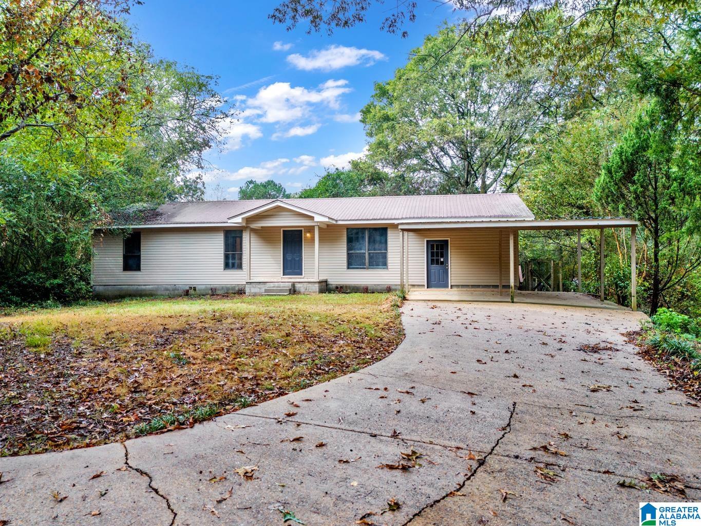 Nestled on approx. 3.4 wooded acres, this charming 3-bedroom, 2-bath home offers the perfect blend of privacy & convenience. Towering trees surround the property, creating a serene backdrop where you can truly relax & unwind. Inside, you’ll love the fresh look of brand-new LVP flooring throughout & the kitchen comes fully equipped with all appliances—making move-in simple & stress-free. With 4 covered parking spaces, there’s plenty of room for vehicles, hobbies, or outdoor gear. Best of all, the location provides quick access to I-22, making a commute to Birmingham just 30 minutes. Whether you’re a first-time buyer ready to put down roots, or moving up to enjoy more land & privacy, this home checks the boxes for comfort, convenience & value.