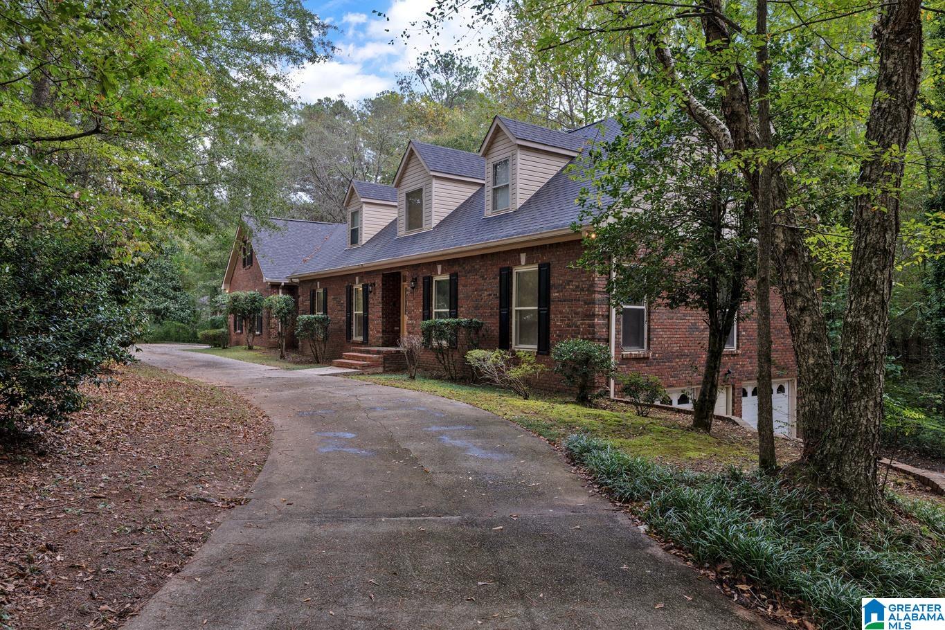 WOW! This one has it ALL! So much space, so unique and so private on 3.3 acres. In-law apartment on main level with private entry, 2nd kitchen, 2nd master bedroom, bedroom, full bath and one car garage with private driveway. The main house offers a huge kitchen with tons of cabinet and countertop space, updated appliances and breakfast area plus a breakfast bar. Formal dining room, formal living room, two story foyer and a beautiful fireplace in den. Master bedroom offers a walk-in closet, his and her vanities, garden tub and separate shower. Additional bedroom and full bathroom on main level. Upstairs has two big bedrooms and full bathroom with separate sinks. There are two large walk-in attic space that you can easily turn into additional bedrooms or living space. The biggest basement you've ever seen! Unfinished and the possibilities are endless. Two sets of stairs to basement, tons of storage and can park multiple cars and boats. So much parking with two driveways & circular drive!