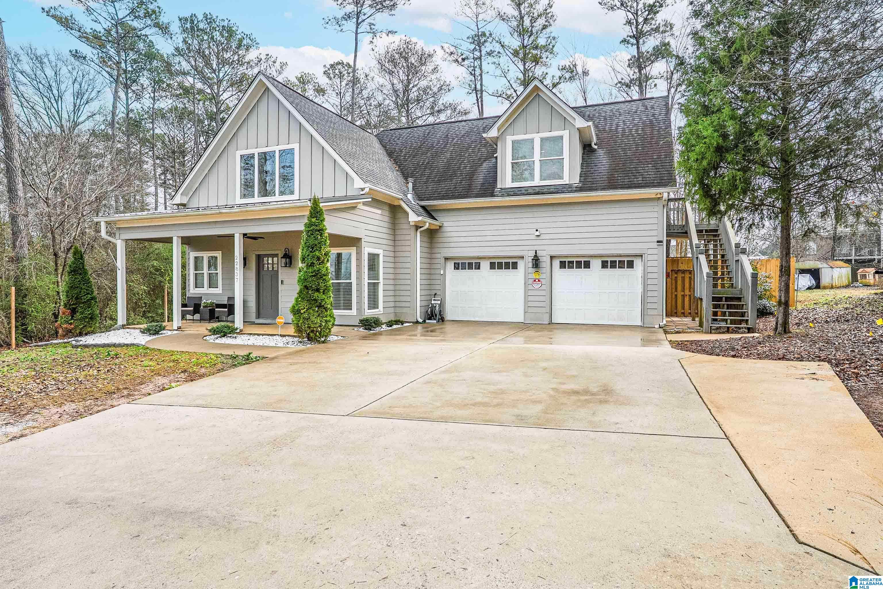Welcome home to 22837 Donnie Brown Drive, a standout 2019 custom-built beauty nestled in a quiet, storybook neighborhood in McCalla. Thoughtfully designed for easy main-level living, this 3BR/3BA home offers a serene primary suite, laundry room, and 2-car garage on the main level, complemented by low-maintenance LVP flooring throughout. The open-concept layout shines with very nice architectural details like vaulted ceilings and a cool spiral staircase leading to a versatile bonus space overlooking the living and dining areas. The beautifully appointed kitchen is loaded with all the bells & whistles, perfect for everyday living or entertaining. Enjoy mornings and evenings on the front and rear covered porches, while the large, fully fenced backyard, storm shelter, abundant storage, and walk-in attic add peace of mind. One of the upstairs bedrooms is oversized with a private entrance making this an ideal in-law/guest suite. Stylish, smart, and truly special—this home is one to see!