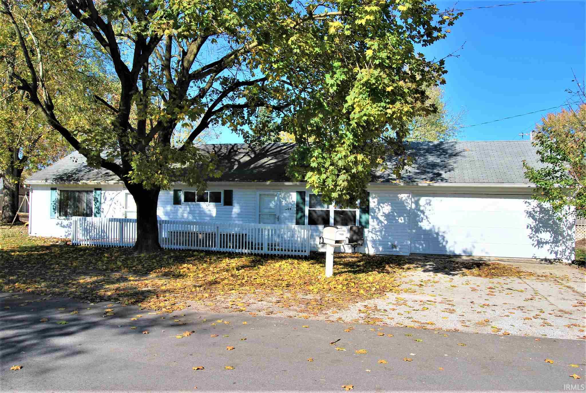 You could move in and celebrate Christmas here! Efficient 4 bedroom 1 bath ranch style home with a large two car garage. New central Air in 2017.  Located just a half block from South Whitley schools. This the perfect home for first time buyers and or families needing another bedroom!