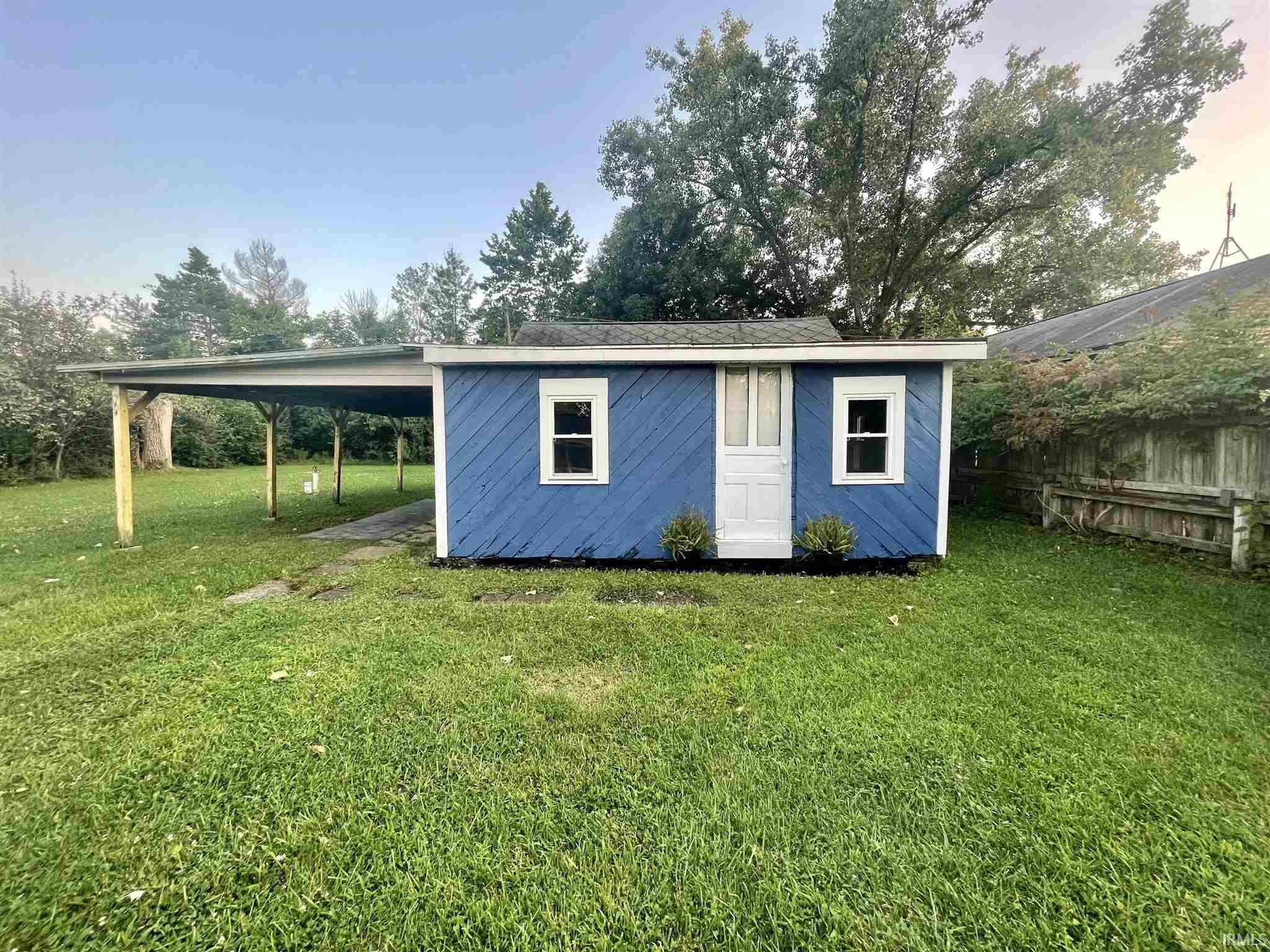 Come see this cozy cottage on Bear Lake.  This home offers all new electrical, pex pipe and water heater.  Carport can be used for parking or for your family gatherings.  Just a 2 minute walk to public access/community park with basketball and sand volleyball court.  The shed is 10X10 for storing all your lake equipment.  You could also easily add a heating unit.  All window AC's stay with the property.  The firepit can be used for those fun family gatherings. A pier may be added to your side of the lake and at least 15ft from other piers.   CASH or STRONG conventional loans only.