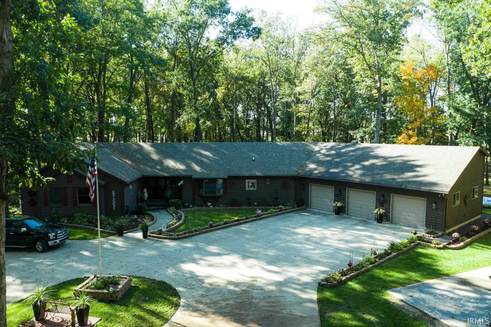 5 acres of privacy and wooded to enjoy the wildlife.  3-4 bedrooms, 2 1/2 baths, sunroom, 2000 sq ft cedar deck (2019), Fully insulated 3+ garage, greenhouse, composite HE & SHE sheds, extra well, newer roof (2012), Trane furnace (2018) with air filtration, remodeled kitchen (2020) with quartz counters, gas stove with pot filler, temperature controlled wine fridge that holds 100 bottles of wine and a full house generator for peace of mind!