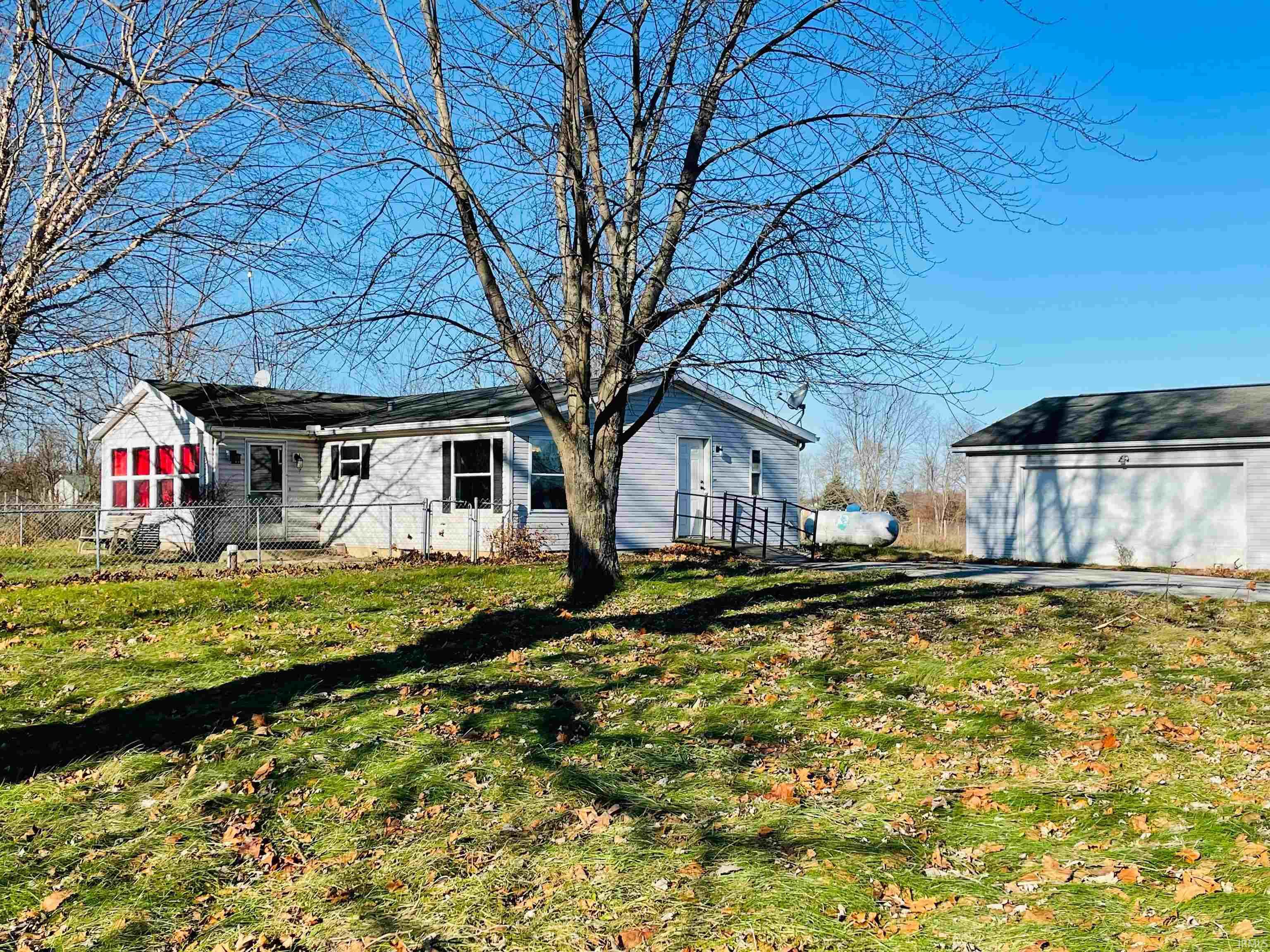All the country charm, yet close to two towns. This 3 bedroom, 2 bath home bordering Whitley and Noble County is sitting on 4 acres with beautiful views of Big Lake. Public access to both Big Lake and Crooked Lake are just minutes away.  Thinking of starting your own mini farm- this property features a fenced-in area and out building that is perfect for all types of animals. The current homeowners started remodeling the home- it just needs your touches to finish a few projects. Schedule your showing and make it yours today.