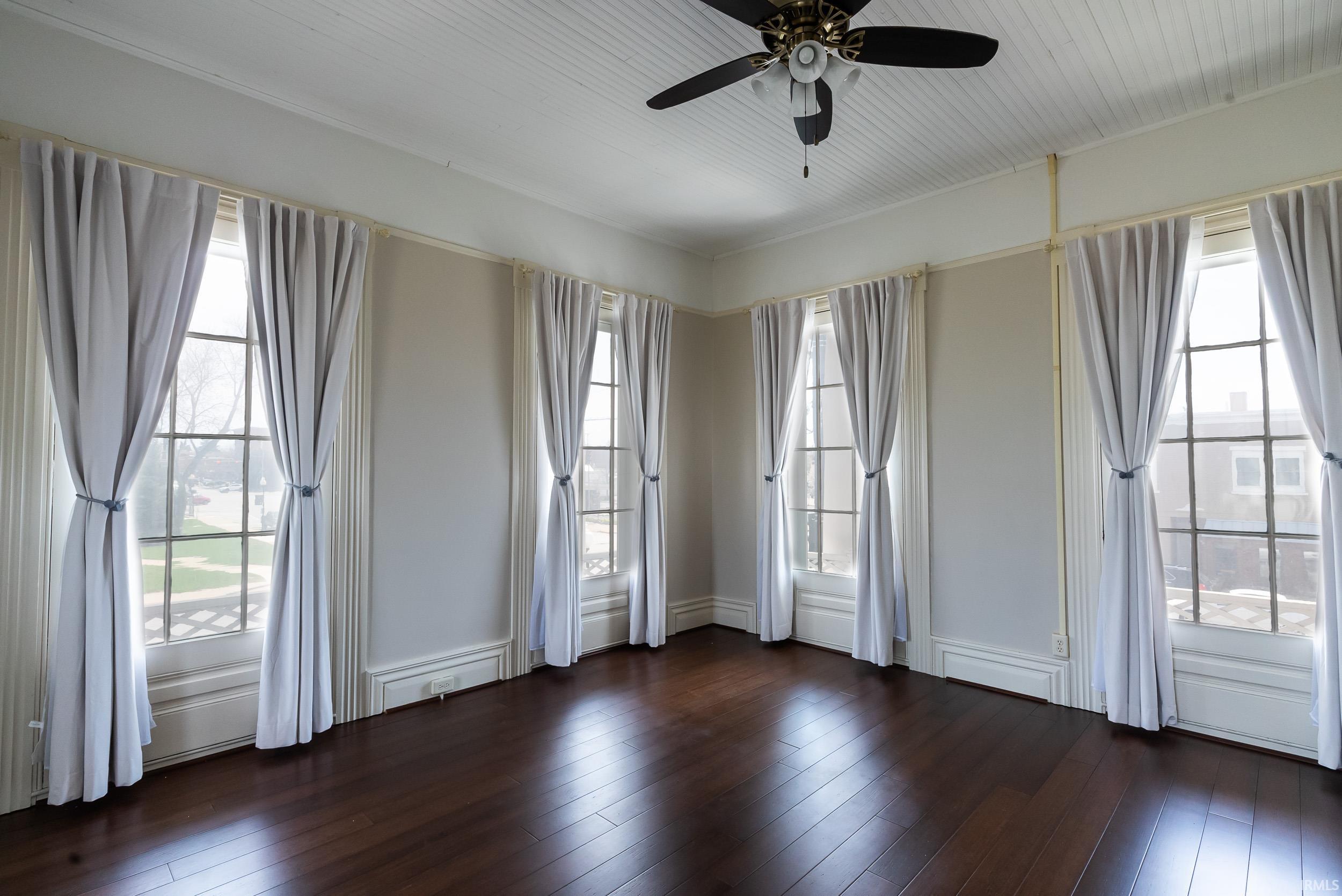 Has own mini split heating and cooling unit. Original curtains.  Piano is included in sale of the house.  This room has 6 doors that lead to the Balcony.  On this balcony the mayor used to address the town.  Size is 15 X 15