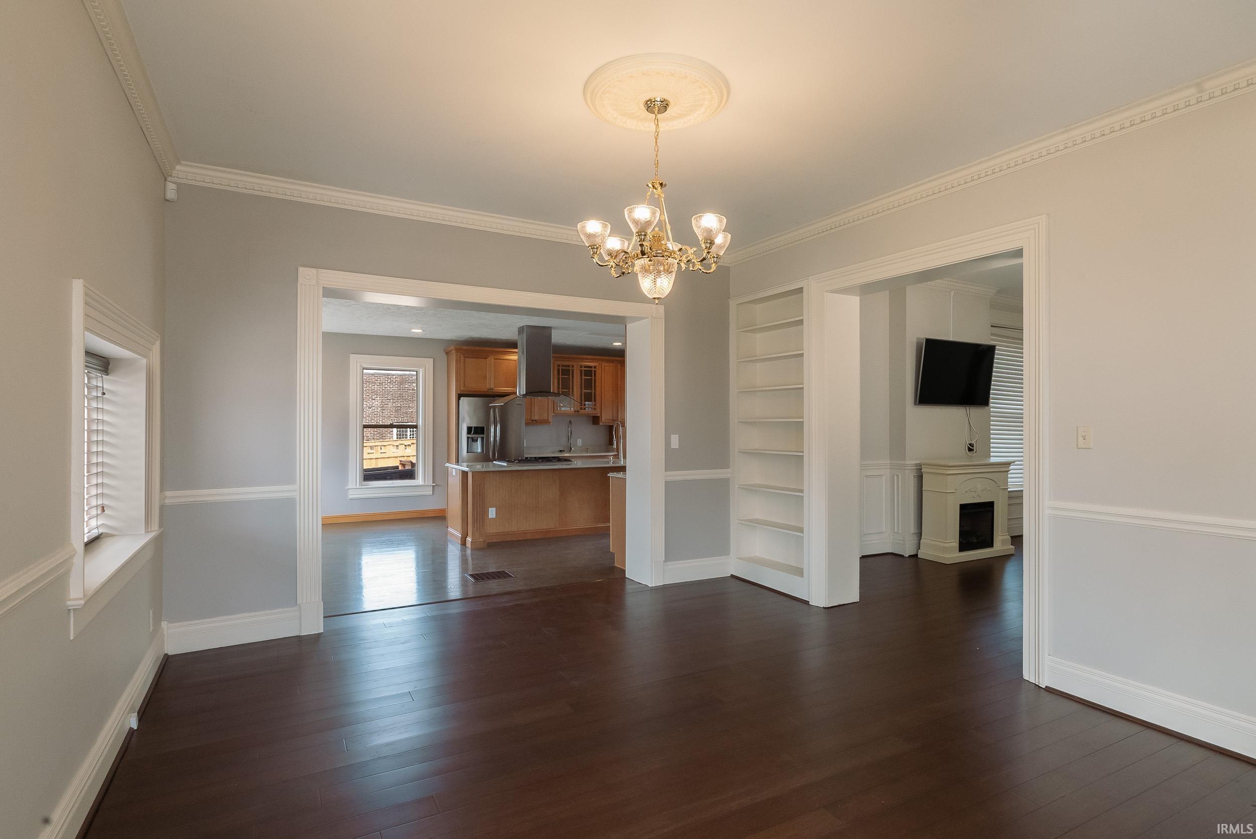 This downtown historic home's unique features include: crown moulding and wood trim.