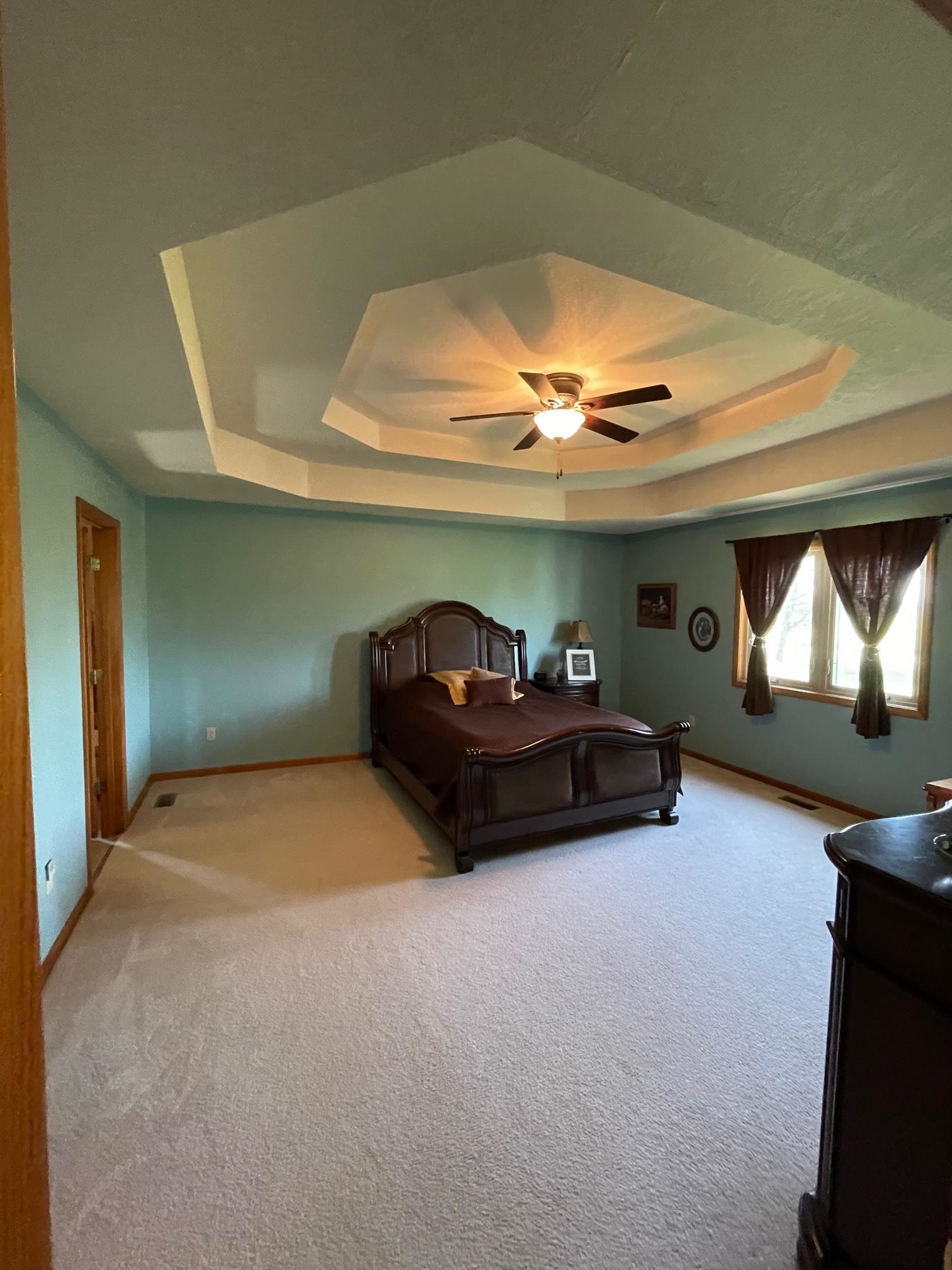 Huge master bedroom with exquisite tray ceilings
