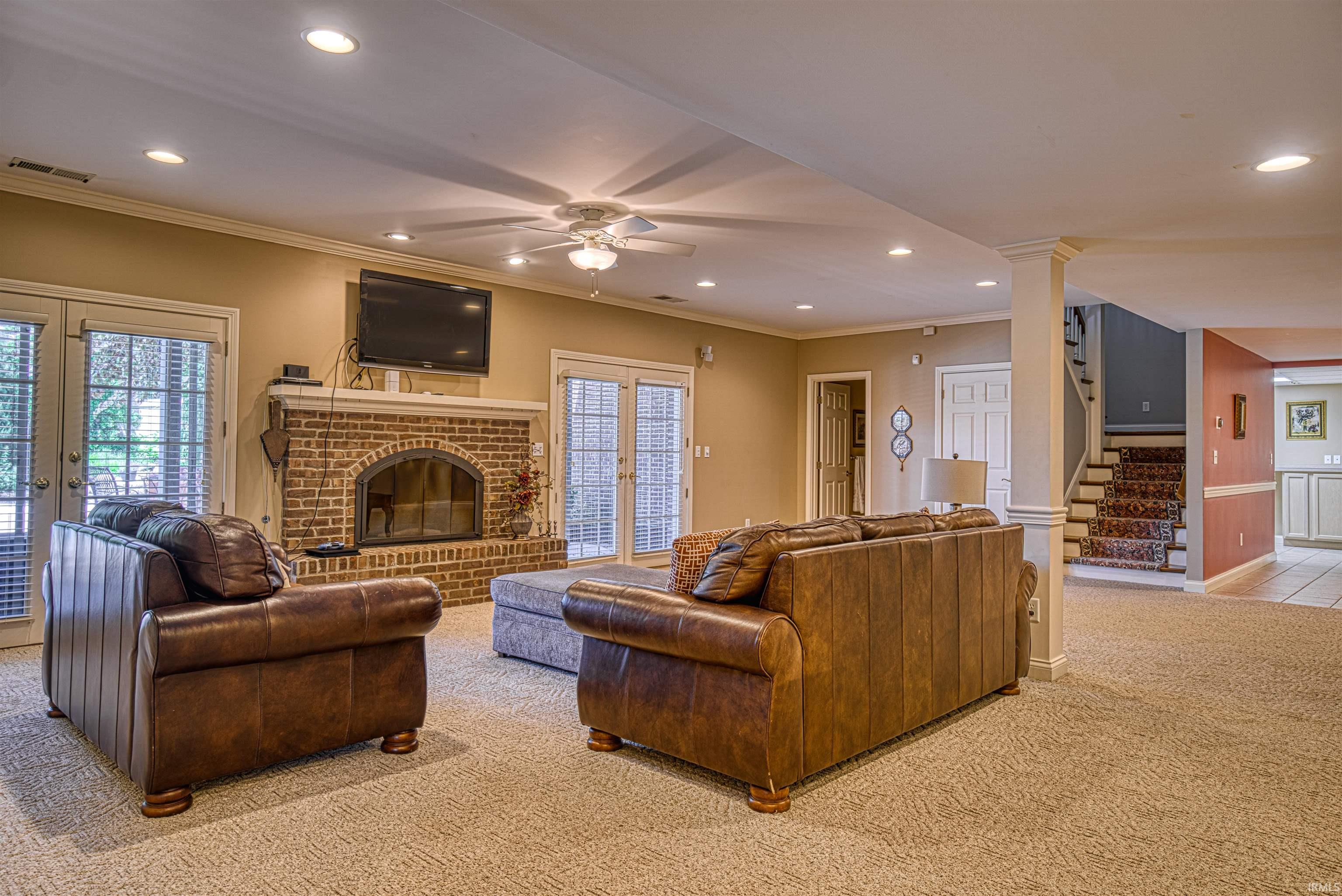 Living area with wood burning fireplace, full bathroom and pool access
