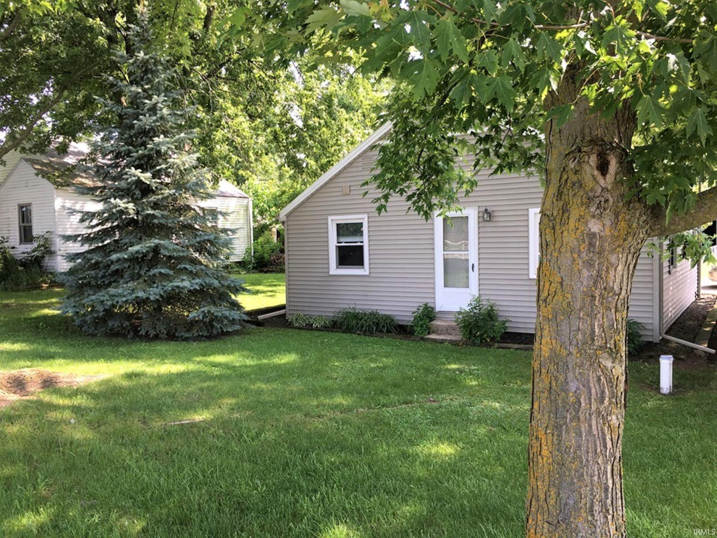 This property is a hobby enthusiast dream as it features a large 22x40 pole barn that is partly insulated and has electricity.  The well maintained 3 bedroom home features new floors installed in 2022, fresh paint (2022 & 2021) newer windows and a metal roof. You'll love the open concept living room/ kitchen area.  All appliances stay- washer & dryer less than 2 years old, and a newer gas stove.  Perfect home for just starting out or downsizing. The fenced in back yard is ready for you to enjoy and entertain, so schedule your showing today.  Property is located close to Churubusco, Albion and Columbia City- close to many lakes, including Chain-o-Lakes.