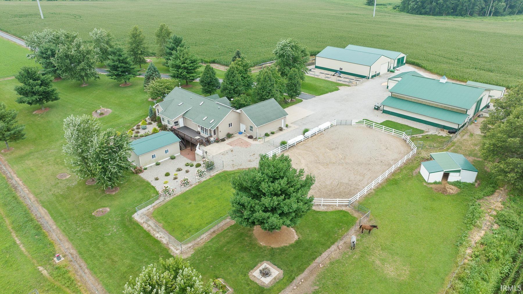 Welcome to a home/land that has one of everything you want or need. Off the 2,000+ ft freshly paved drive sits a 5-bedroom 3 Full bath home with a rare 251+/- acres. Solar panels(owned) were installed in 2018. The horse barn is a 60x84 - 48x72 pole barn constructed in 2019 and another constructed in 32x72 2020. This home has a horse stable in the barn that attach to a riding arena and a large paddock that the home overlooks. There are 122+/-ac of great tiled tillable ground. The planted food plot alfalfa fields with tower blinds make for exceptional hunting. This land has produced 2 Boone and Crocket bucks and 3 in the Indiana record book with many other great whitetails. There are some wetlands to the NE corner that brings in many duck and many other flighted animals for great views/hunting. This property borders DNR wetlands which makes this tract hunt bigger and expands the views. Many things can be said about this home, but you need to view it to take it all in!