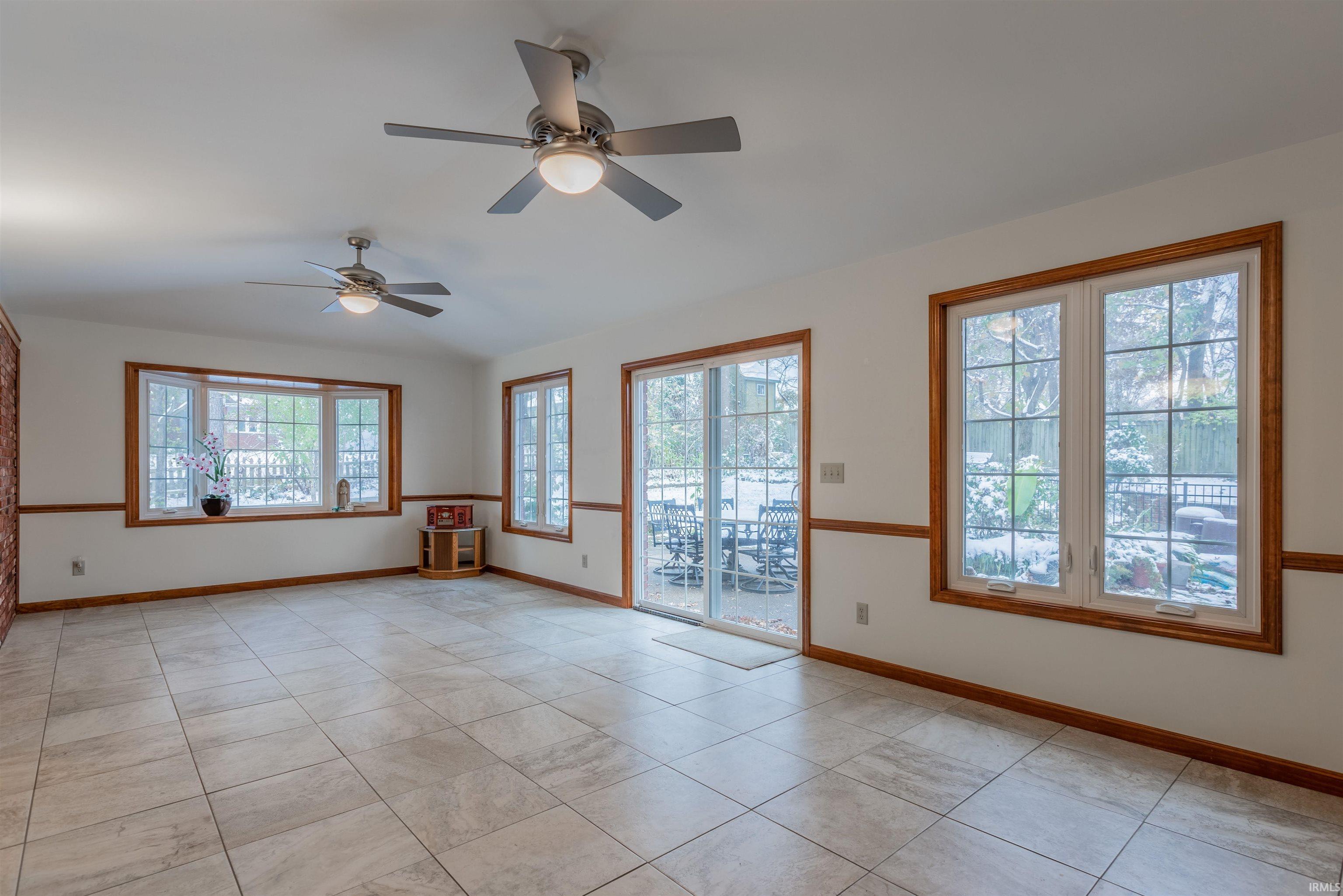 ...with two Ceiling Fans, Bay Window, Patio Doors to Flex Room and to outside Patio