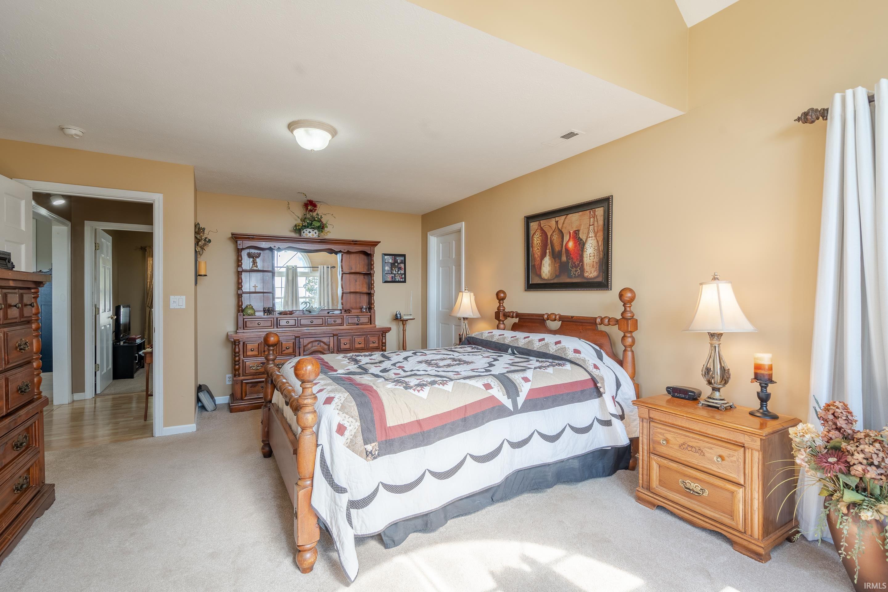 THIS SPACIOUS MASTER  OFFERS LOTS OF BEAUTIFUL WINDOWS INCLUDING A LARGE ARCHED WINDOW.  THERE IS ALSO A HUGE WALK IN CLOSET, YOU WON'T BELIEVE THE SIZE OF IT.