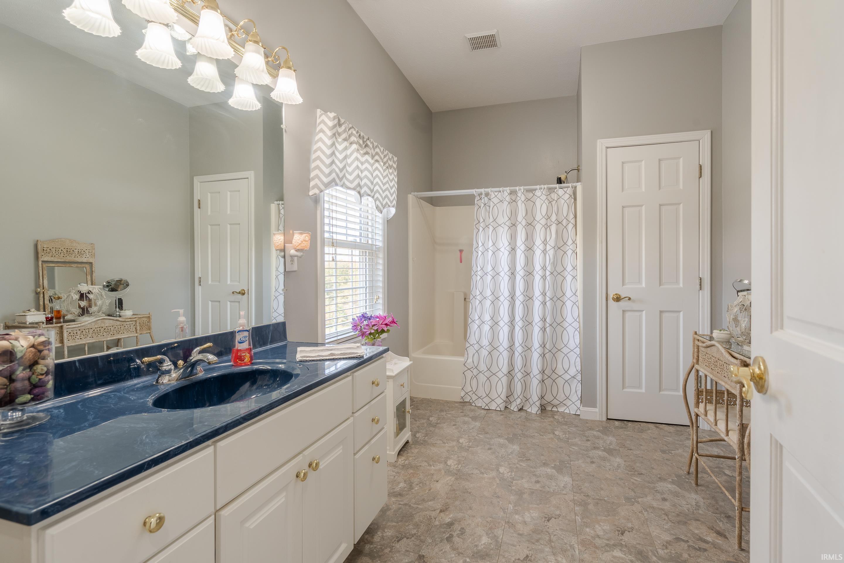 YOU WILL ENJOY THE GREAT SPACE IN THE FULL BATH.  TUB/SHOWER UNIT WITH LINEN CLOSET, VINYL/TILE FLOORING AND A LARGE VANITY.