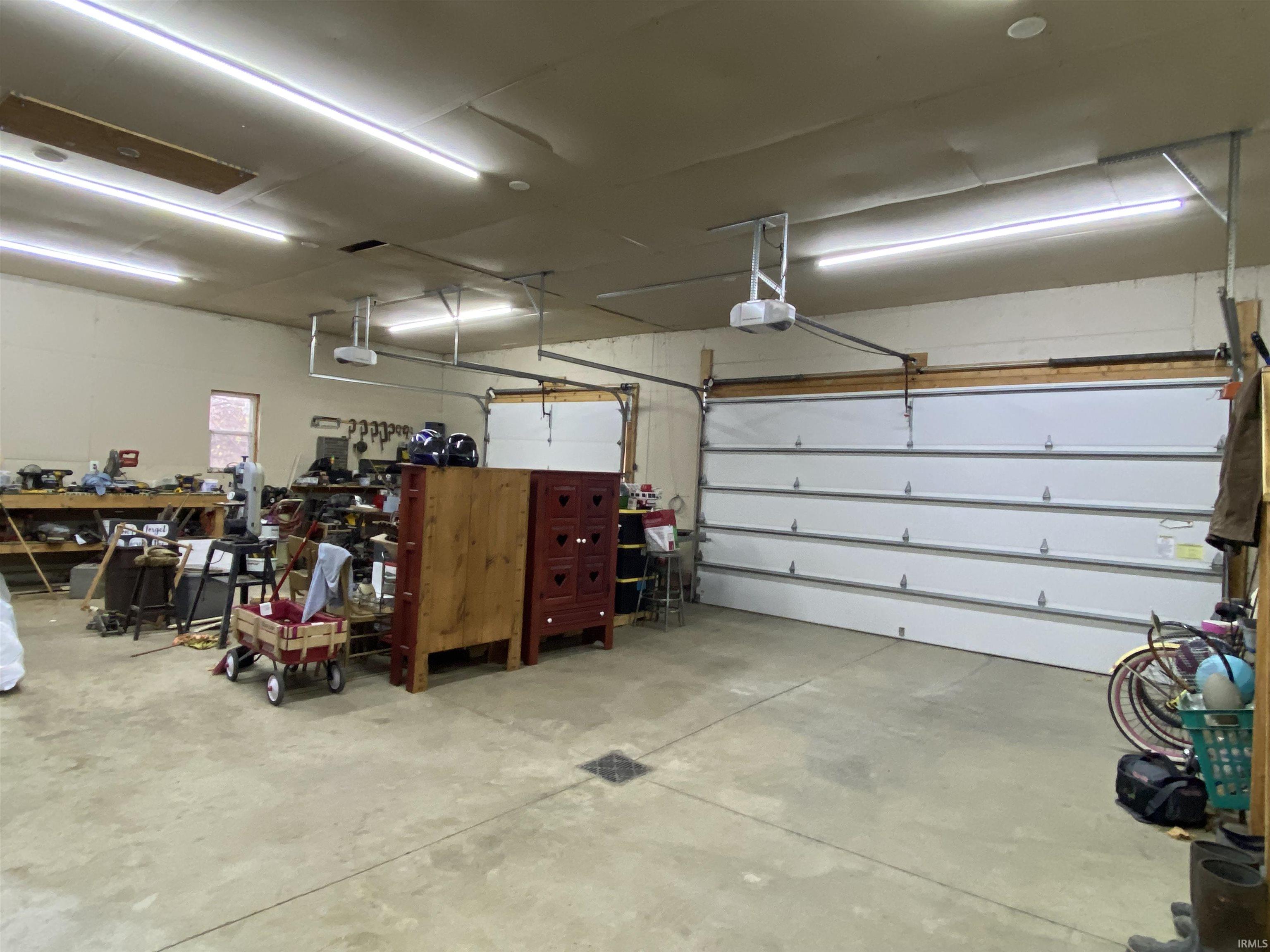 Garage has Attic Winch System to Make Storage a Breeze!  Heated Floors are also ready to be hooked up in the Garage.