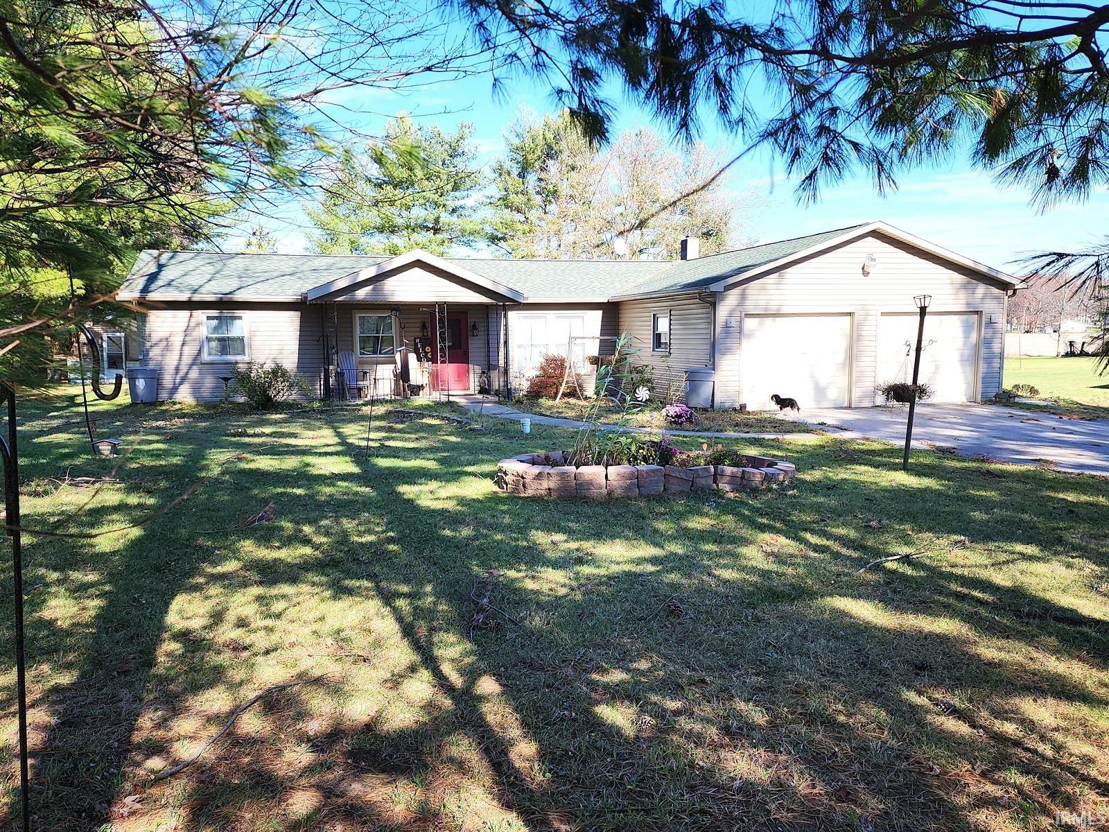 In 2017 this home, just between Fort Wayne and Columbia City, received new windows, new siding, and a new roof! All of the big ticket items are new and with some imagination, this charming ranch can be your perfect home. This home in the country boasts 3 beds, 1.5 baths, a 3 seasons room, and multiple outbuildings perfect for a hobbyist or toy storage. There's also a greenhouse for those who like to grow their own plants and vegetables all year long.  *Cash or Conventional only*