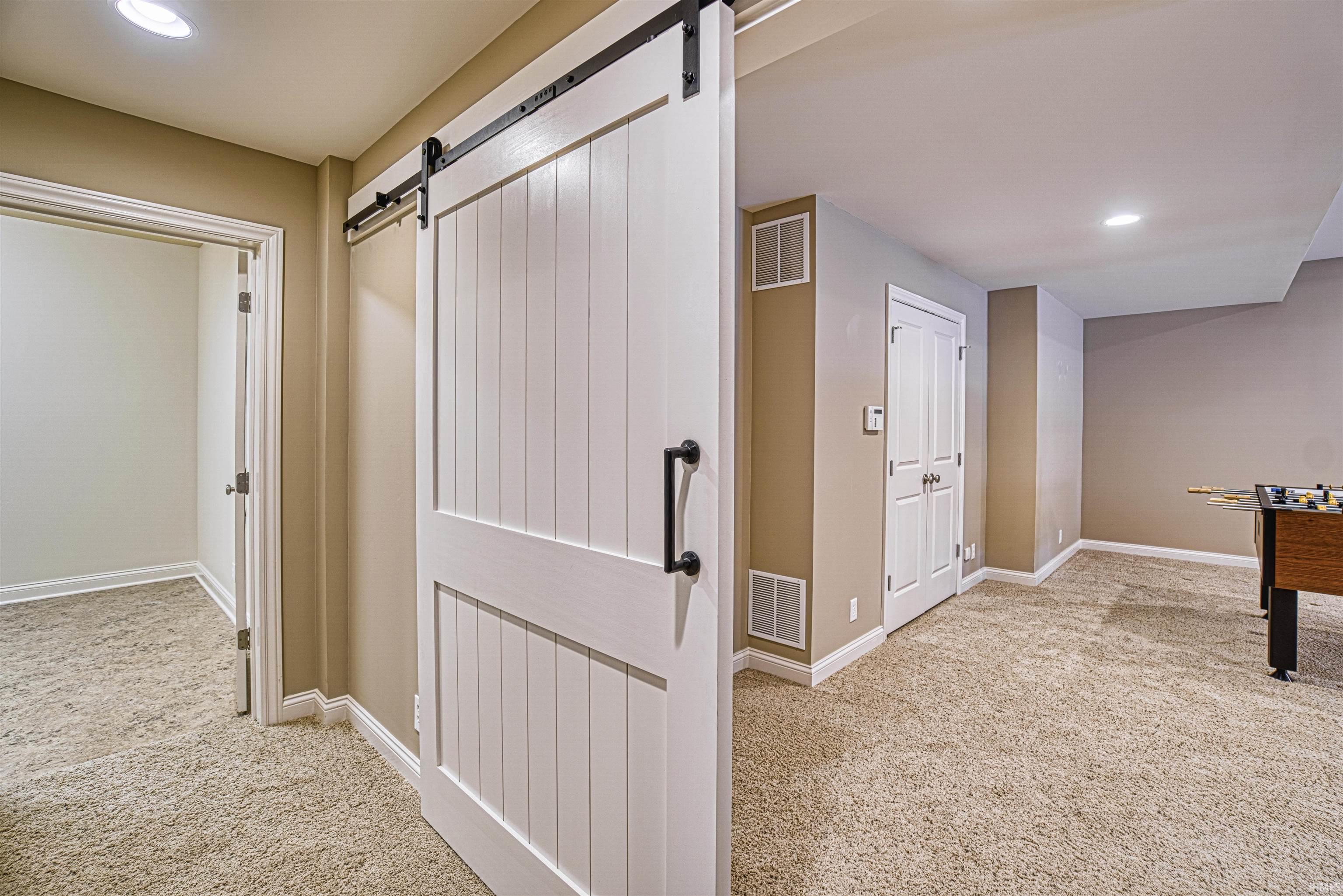 The barn door separates the in-law suite that offers...