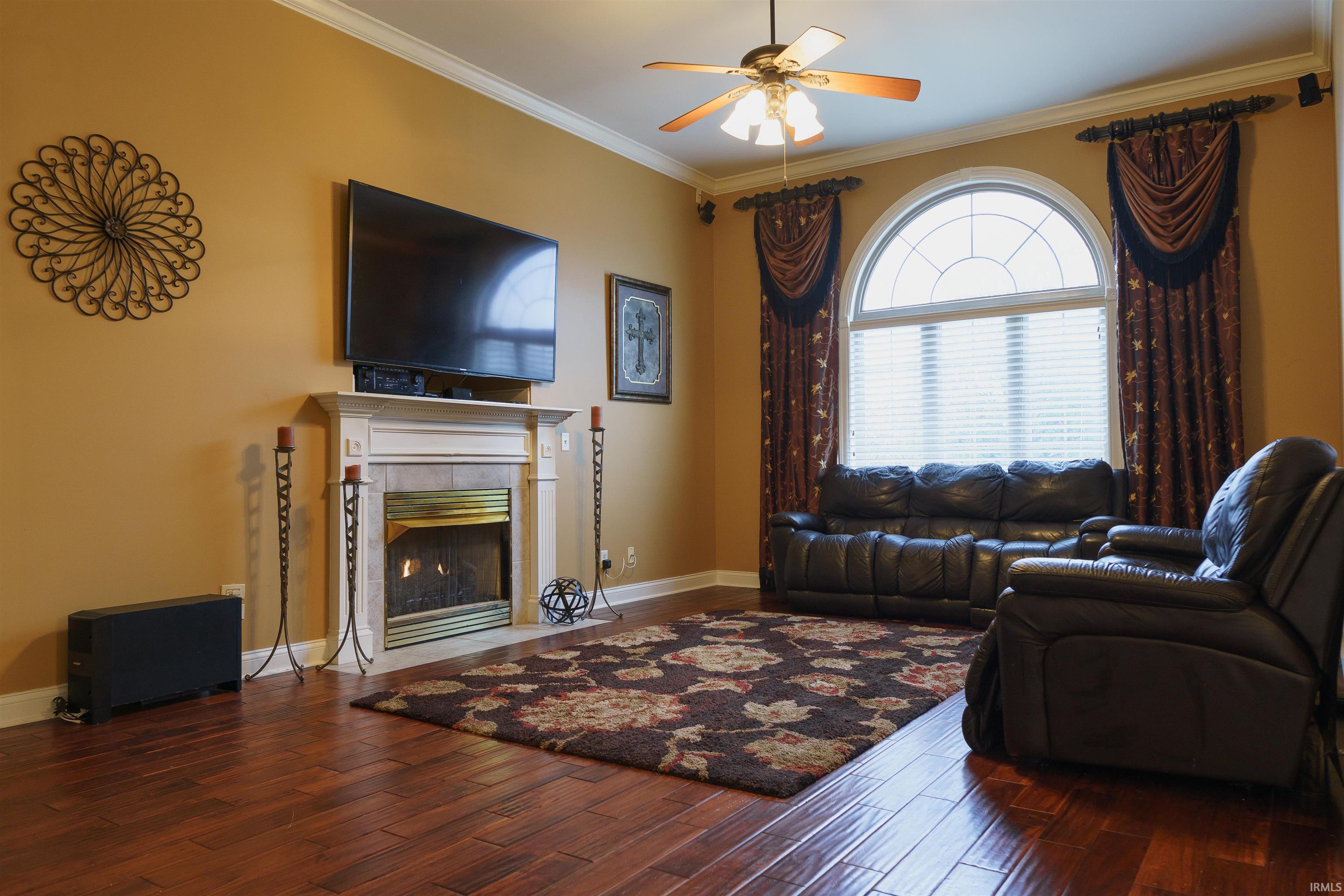 Beautiful floors, gas log fireplace, arched windows