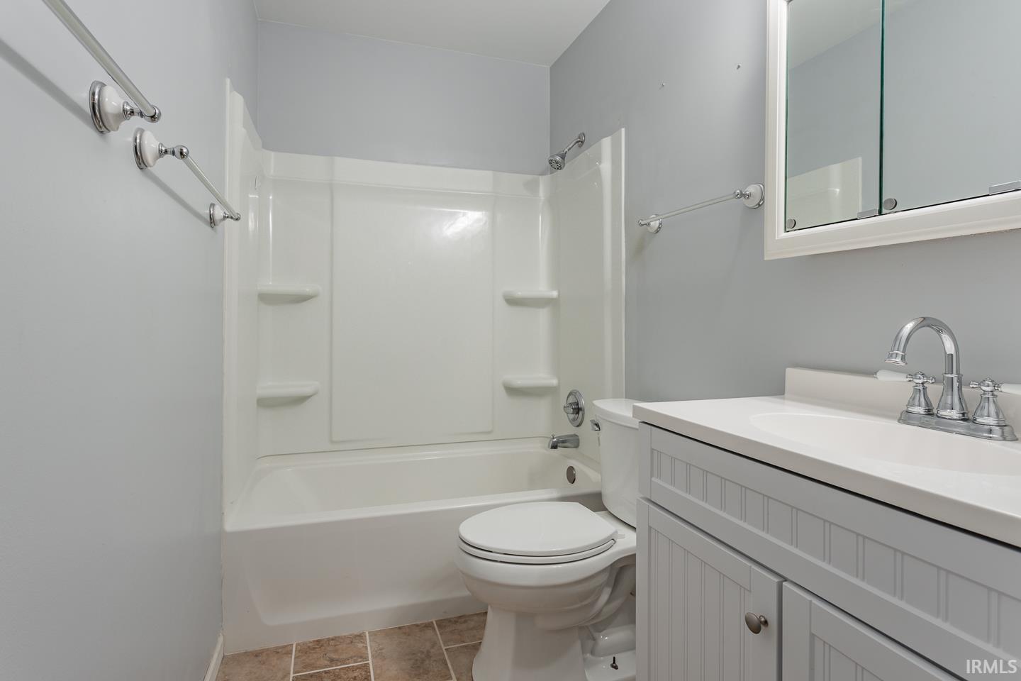 The upper level Full Bath has a linen closet and was updated in 2020 with new tub/shower combo, vanity, commode, and tile floor.