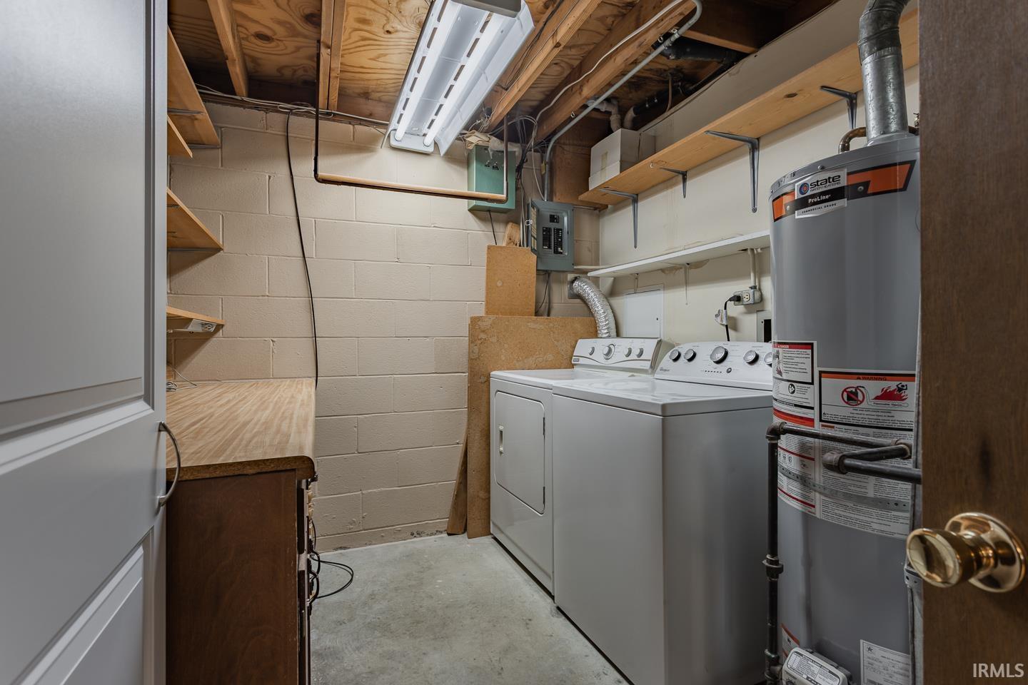 The utility room storage and counter space for laundry. The washer and dryer are included!