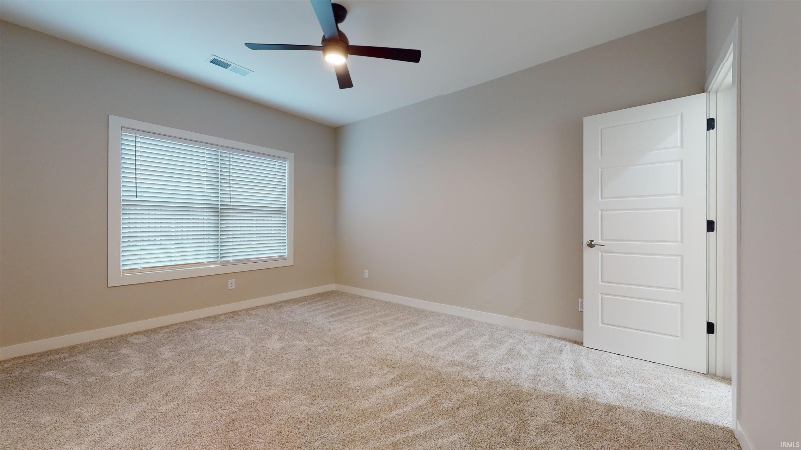 Located off of the great room and features a walk-in-closet, and a private bathroom.