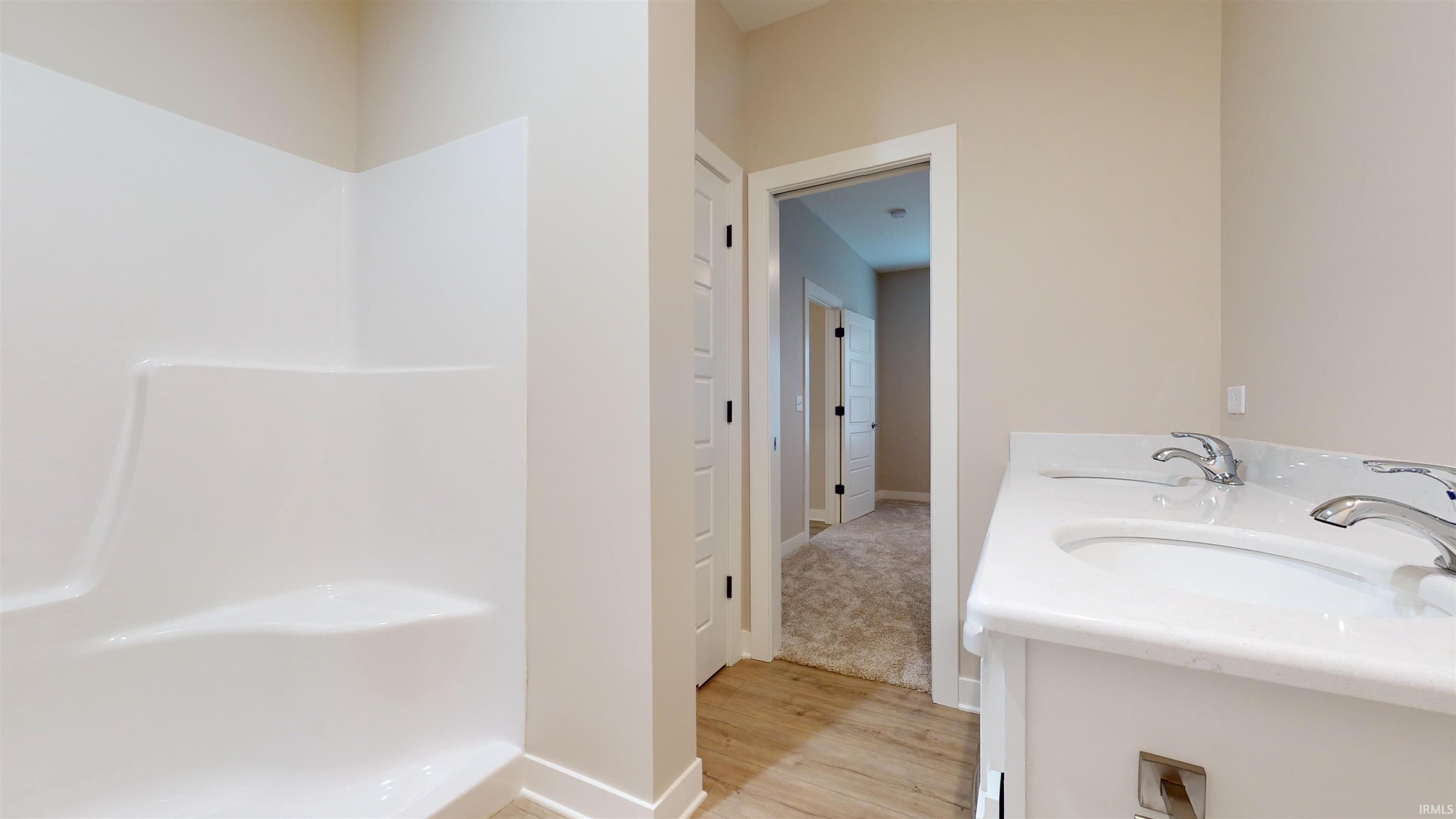 Hall Bath is located between the two bedrooms off of the foyer.