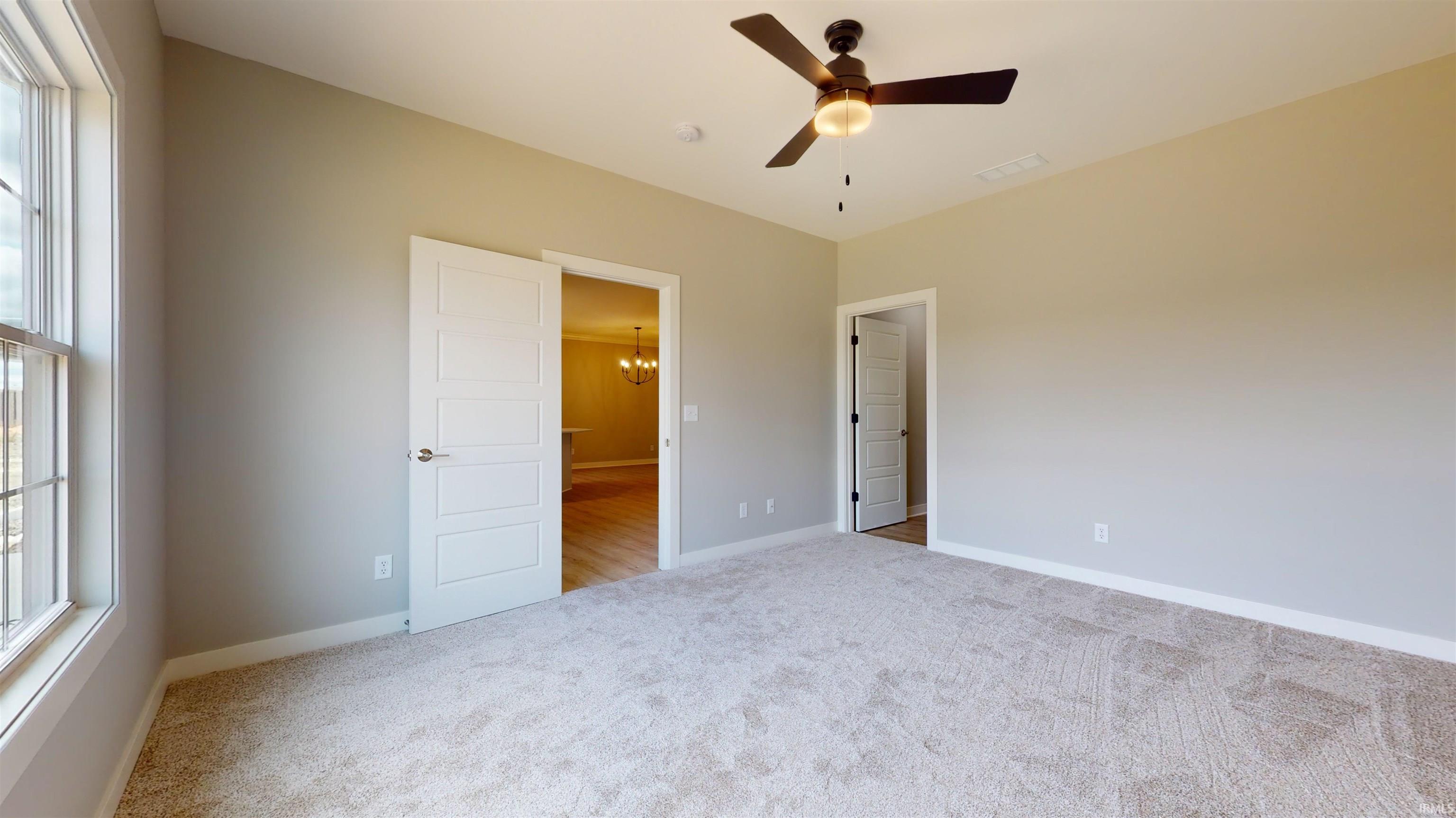 The laundry closet & pantry closet are located in the hallway between the garage and the kitchen/dining.