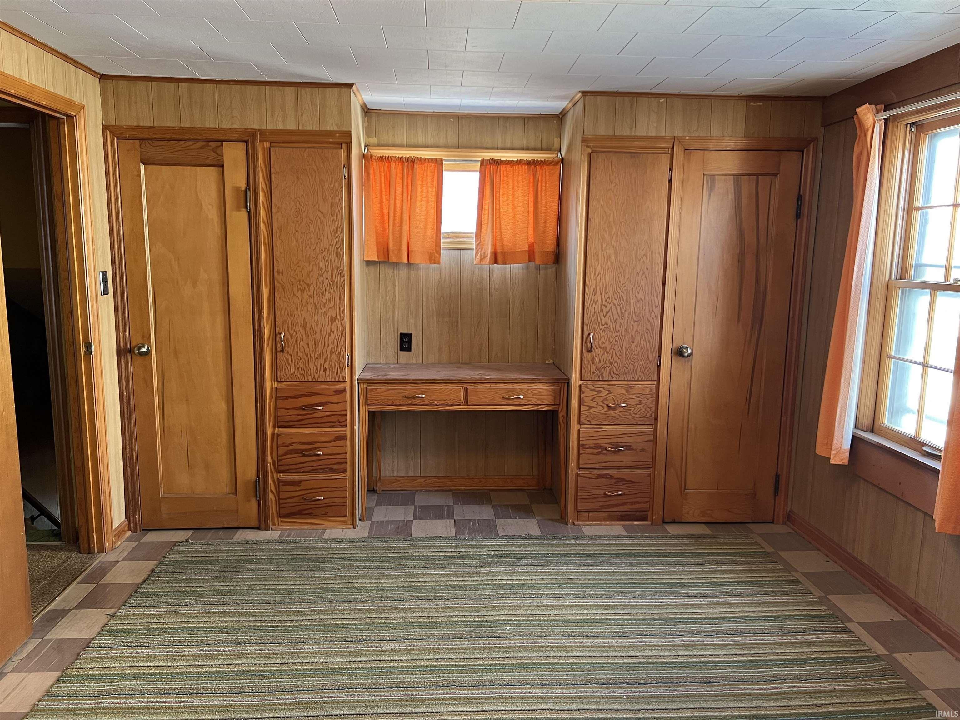 Upstairs are 4 Additional Bedrooms with some desks and cubbies, a Full Bath, and a second Half Bath.