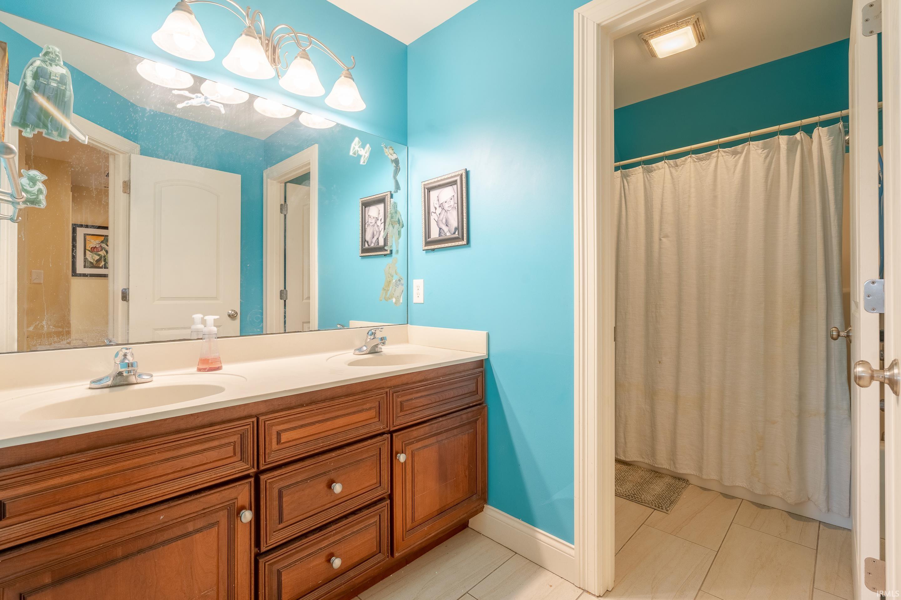 Upstairs hall bath with dual sinks.  Door to Tub/shower and toilet for privacy..