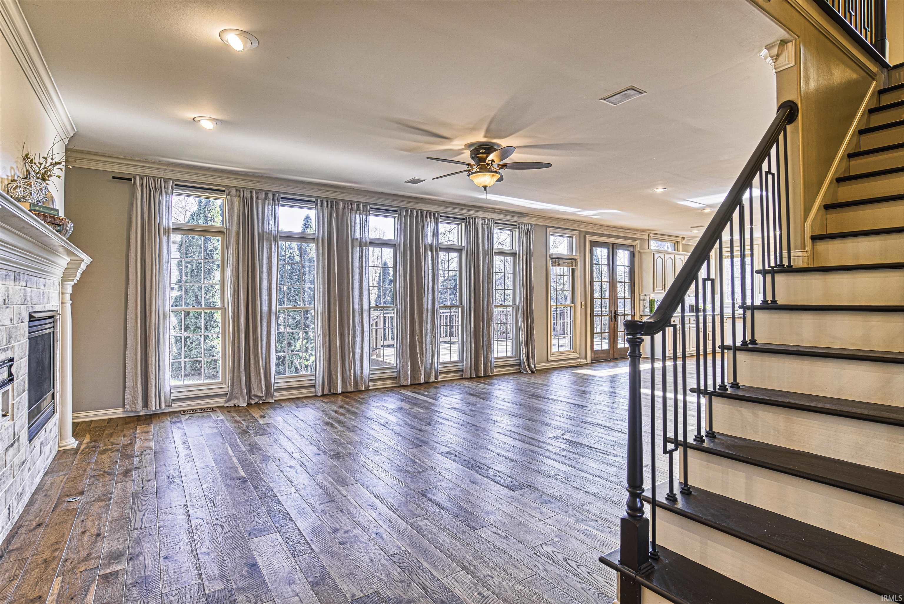The foyer opens to a spacious great room with...