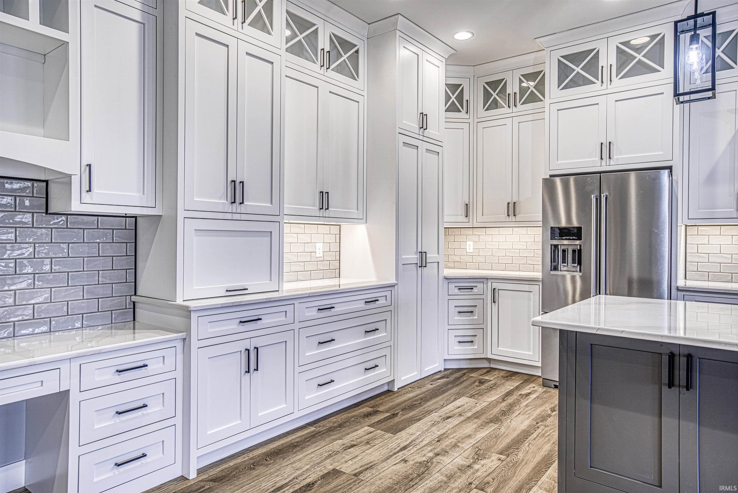 An abundance of custom cabinetry with several built-in features...