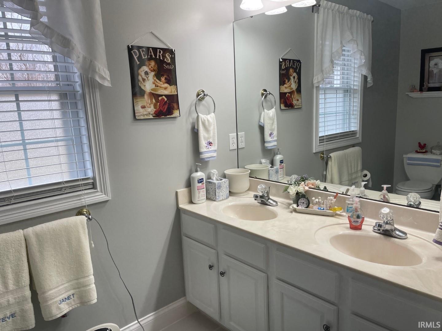 Dual vanity sink and linen closet