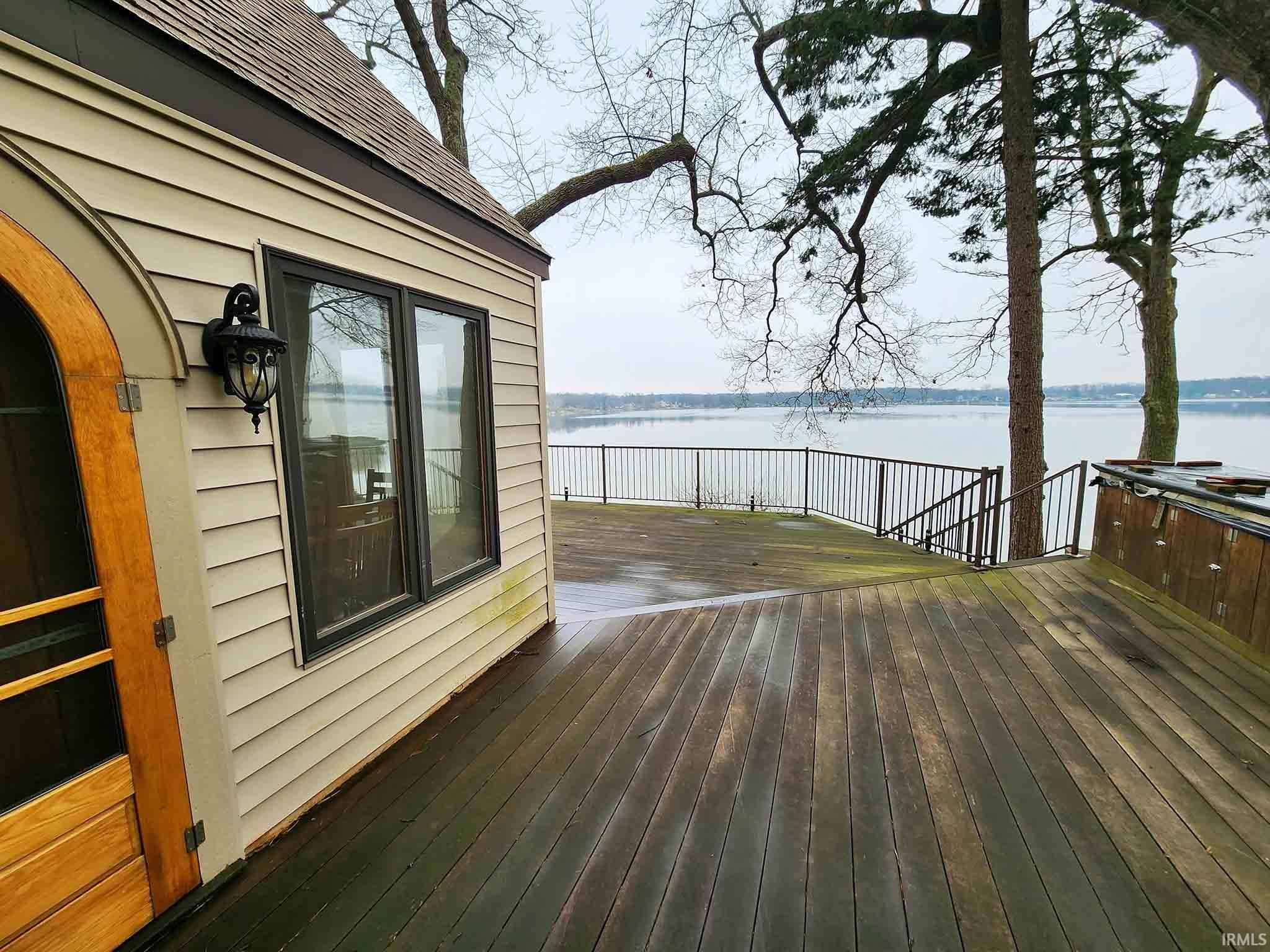Lakeside deck and side of home.