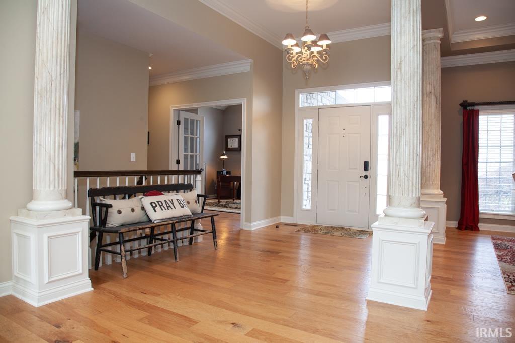 Inviting Entry with Wood Flooring and Soaring Ceiling
