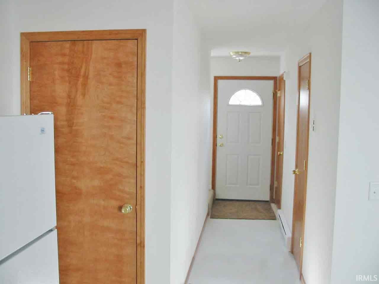 Main level entry with closets.