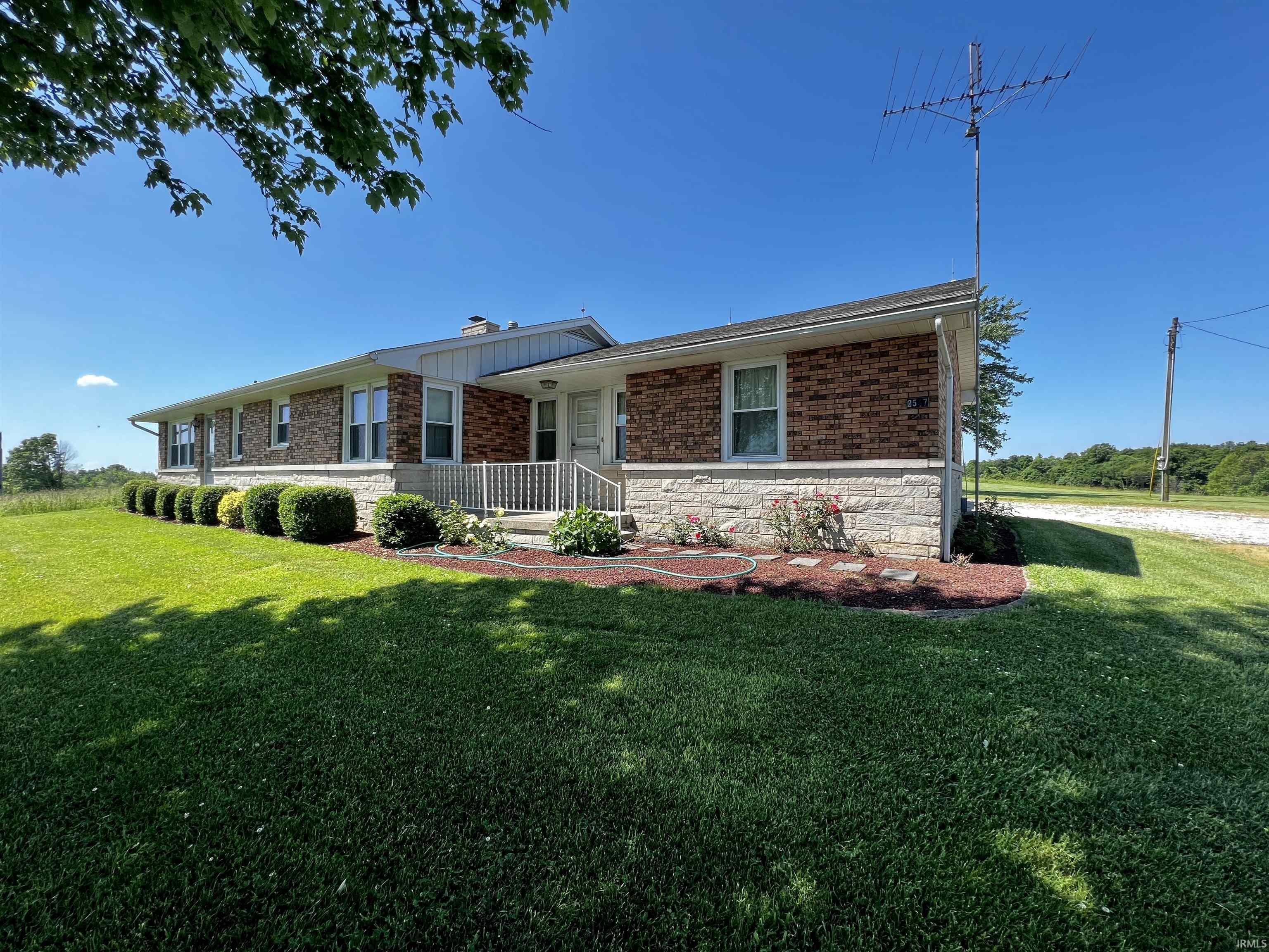 Check out this well-kept country homestead with great views and plenty of room to grow. This 4Bd/2Ba brick ranch sits in a quiet and peaceful area with a beautifully commanding view of its surroundings. Located along a paved county road, this home features 1828 sq ft of well-kept finished living space with a 1320 sq ft basement. Sitting just behind the home is a 1/8 acre spring-fed pond that offers a perfect place to sit and enjoy your new view. An expansive lot provides plenty of space to garden or raise livestock and boasts over 450' of county road frontage. The large poultry barn and utility sheds offer ample space for storage and have endless possibilities to suit your needs. If you've been searching for a quiet country home that offers plenty of room to grow, has loads of storage, and comes with incredible views, you should certainly take a closer look at this listing.