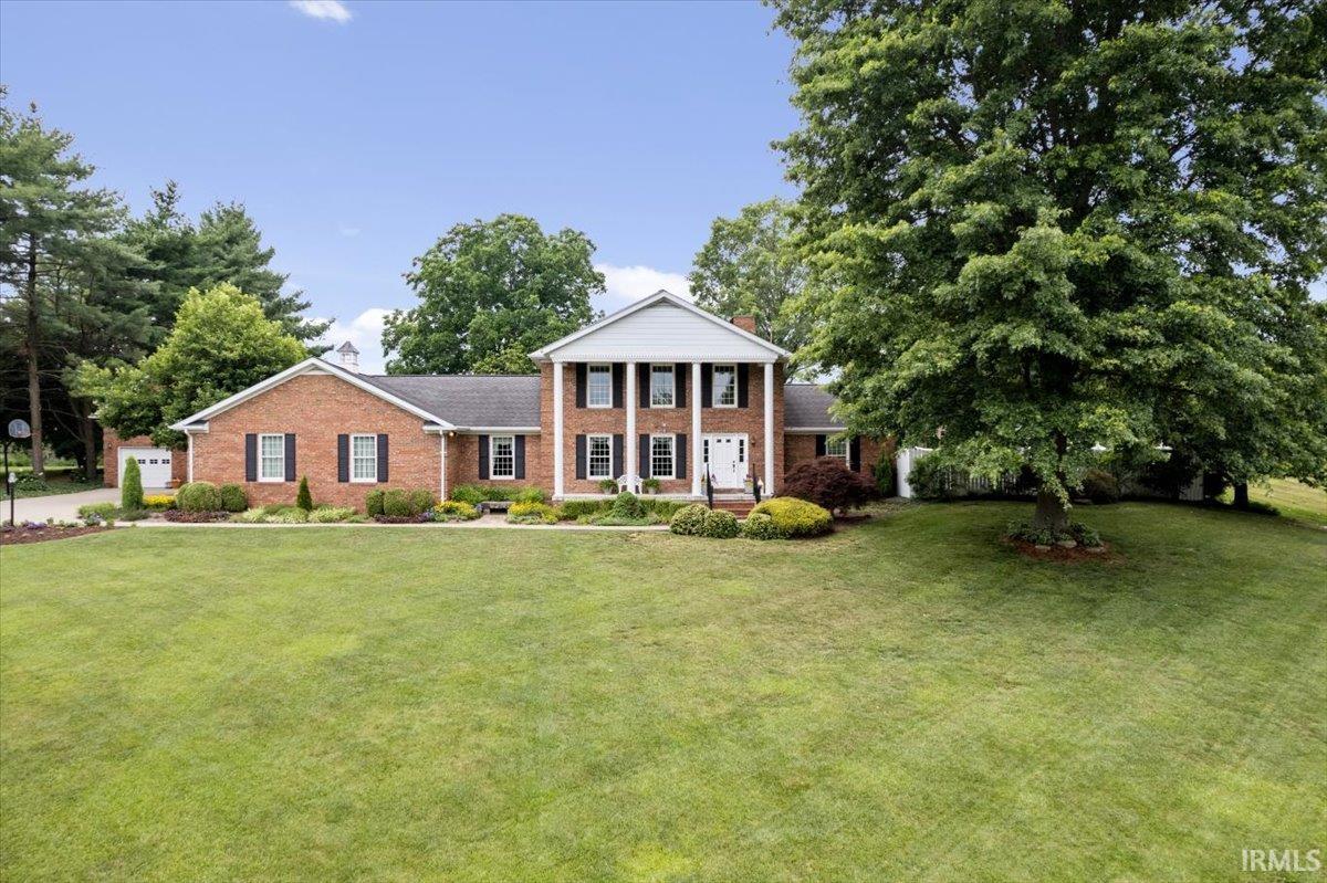 This meticulously kept, all brick, 5 bedroom, 4 full bath and 2 half bath home sits on .89A on Foxridge Drive in the established neighborhood of Grassland Hills, which is minutes away from all the Jasper schools. The thoughtfully landscaped grounds has a path that invites you to the front porch. Upon entrance, you are warmly welcomed by the tiled floors and a flow-through living room into the dining room.  Moving on, you are drawn into an open concept kitchen, breakfast area and family room, which is the heart of the home, all with parquet flooring.  The kitchen is a large U shaped design with stainless JENN-AIR appliances, granite counters, and a tiled backsplash.  Adjacent to this area is a Florida room which leads to the in-ground pool on one side and a  2nd brick lined patio on the other. The main floor is completed with an ensuite Master Bedroom, a second bedroom, a bath with walk-in shower and a laundry room.  Upstairs you will find 3 more bedrooms and a full bath with 2 sink areas.  The carriage house provides additional 2 bay parking, a separate workshop, with a full studio apartment on the upper level.  The backyard provides space for gardening and entertaining. This home has many extras including gutter leaf guard on Main house and Carriage house. Central Vac in home. Tilt-in windows for easier cleaning. Heated flooring in bath off the kitchen. Crown molding throughout; Under counter lighting in the kitchen;