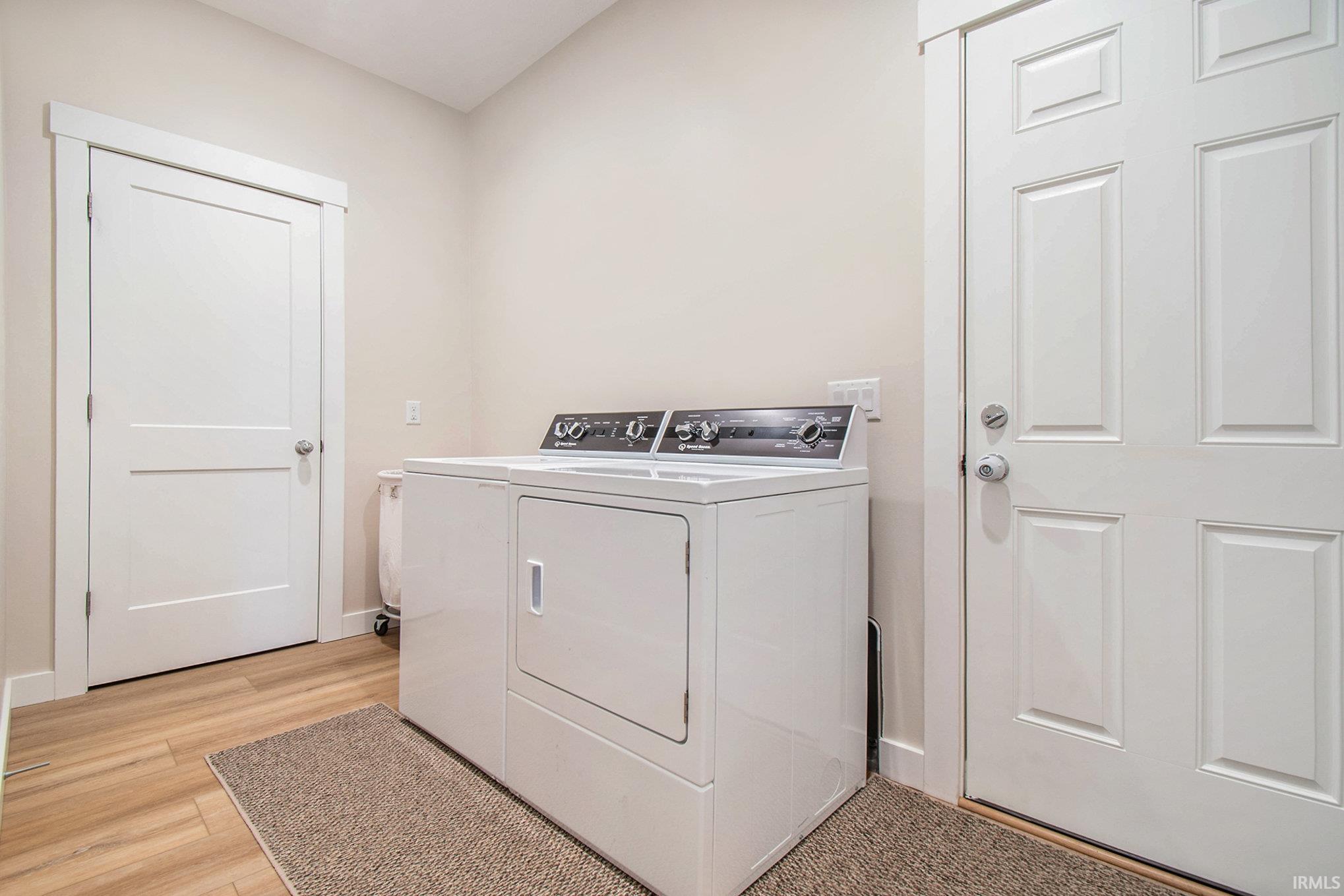 Main Floor Laundry room is in between garage and kitchen. Commericial Speed Queen Washer & Dryer is included.