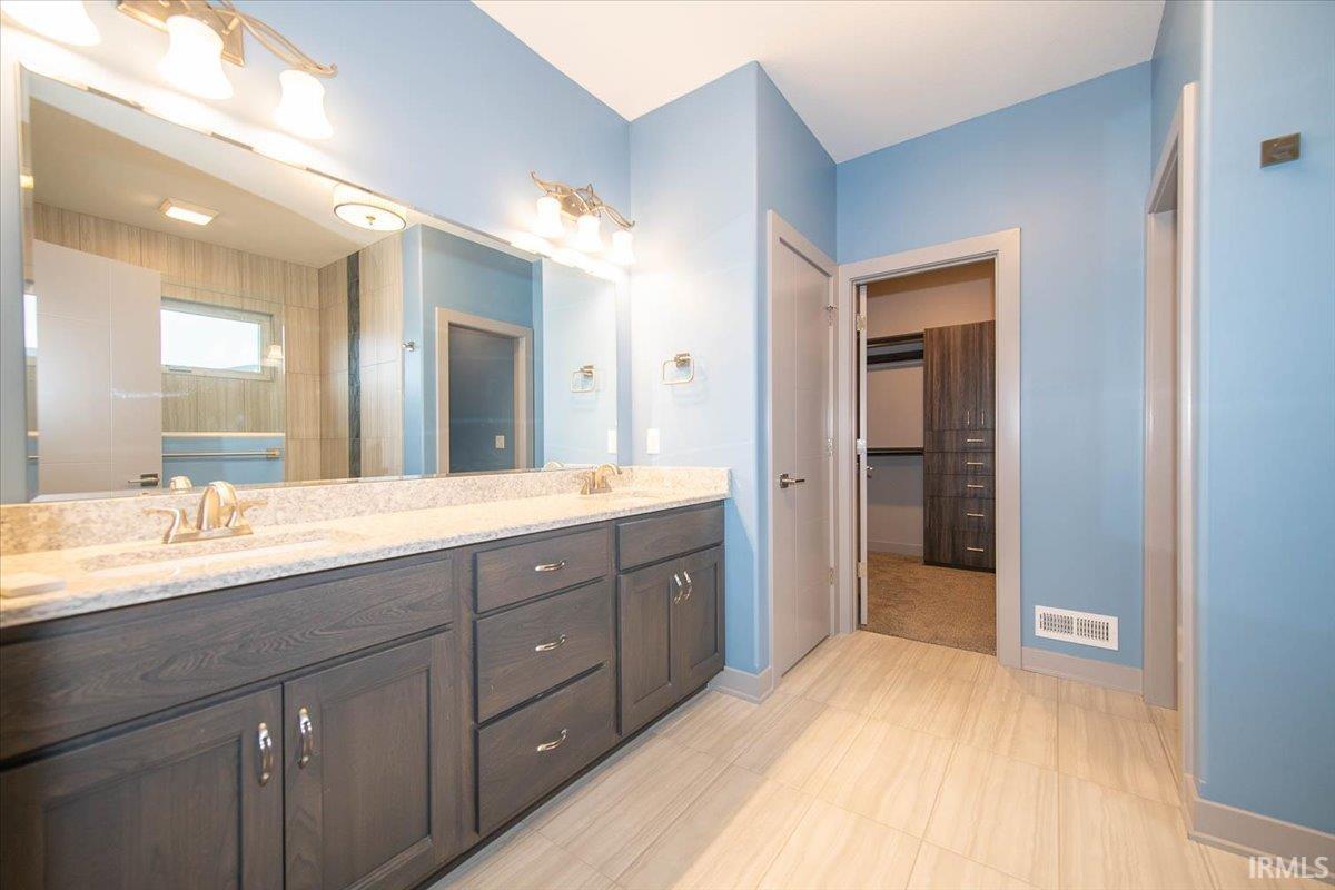 The Master Bath has Double Vanities and a true Walk In Shower