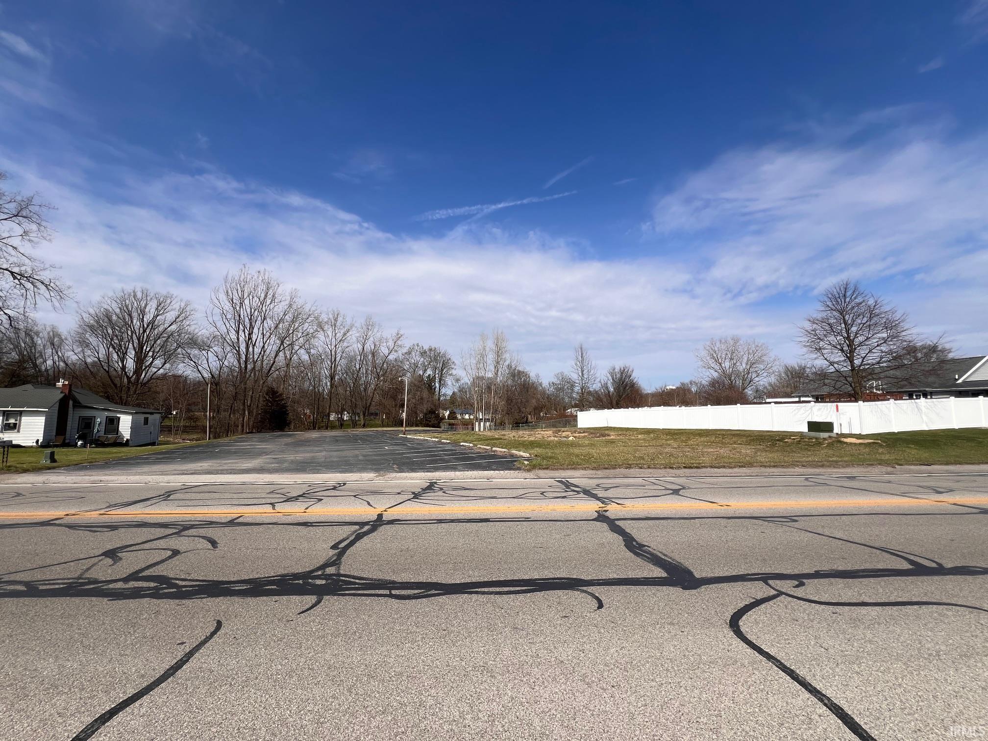 Take a look at this ready to build on double lot in Columbia City. This property offers over an acre of land, and a large paved parking lot that could be used for a future building project.