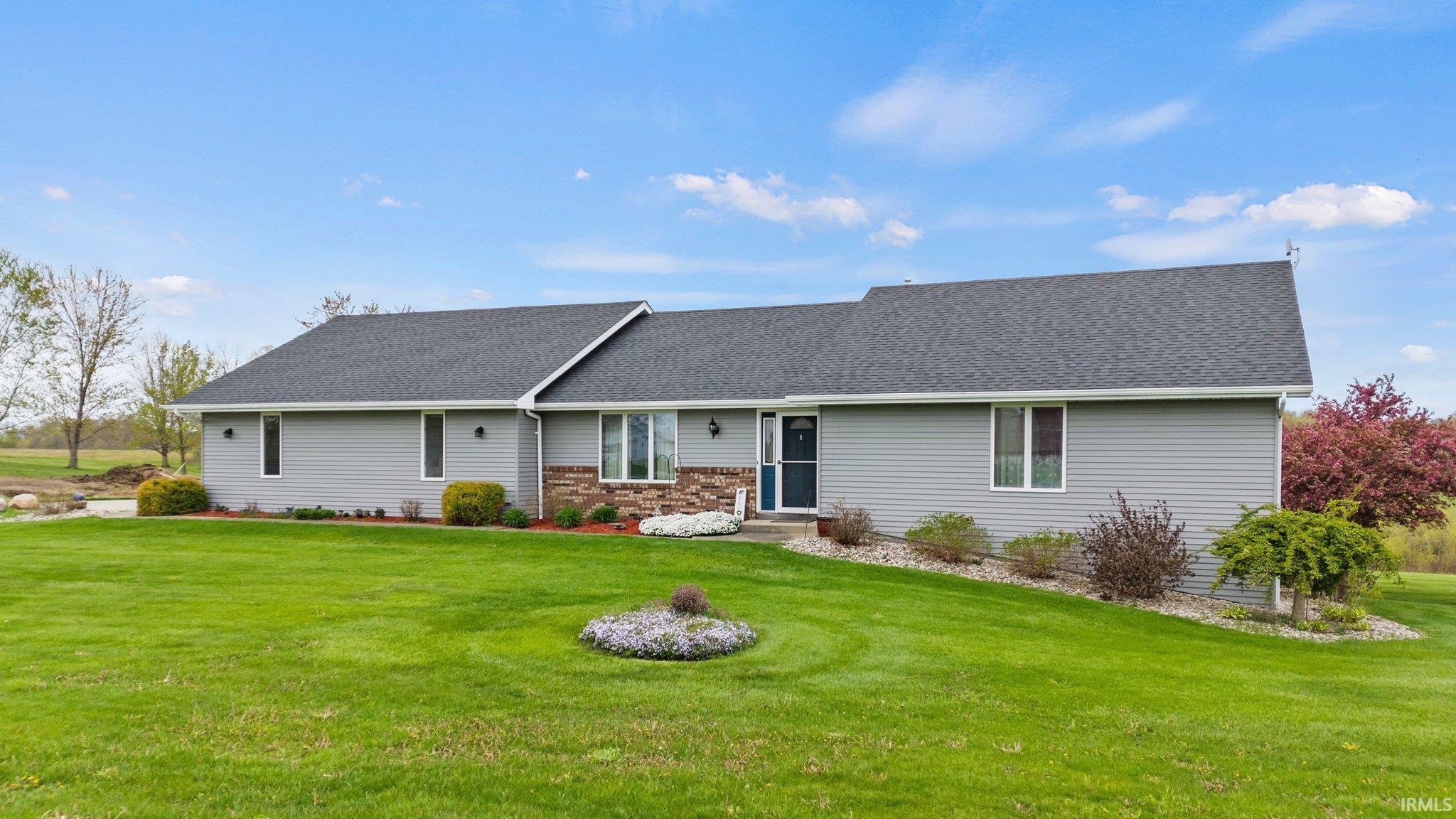Have you been looking for a ranch on a basement, with a country setting, just a couple miles outside of town? Well this beautifully kept 3 bedroom, 3 bath home offers just under 3000 finished square feet, a 24 X 40 pole building for all of your toys or tinkering, fully finished walk out basement, serene country setting, new roof in 2023, and so much more! Large bedrooms, walk in closets in each bedroom, walk in pantry, walk in laundry, and a fireplace for cozy winter evenings in the country. Let's not forget the deck, rear side patios, and the views!!!