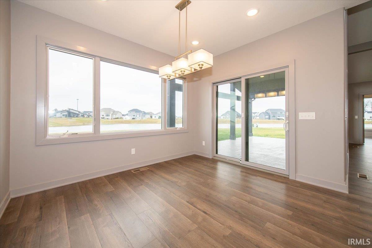 The Breakfast Room leads out to an Incredible Covered Patio and has Water Views as well.